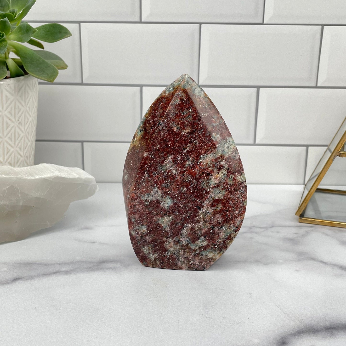 Amazonite Flame Polished Point displayed as home decor