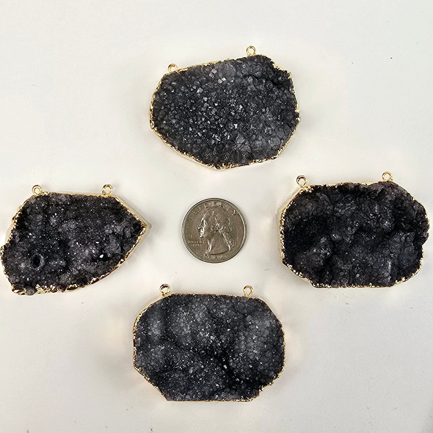 Gray Amethyst Druzy Oval Slab Pendant with 24k Gold Electroplated Edge and Double Bail four on white background with quarter for size reference