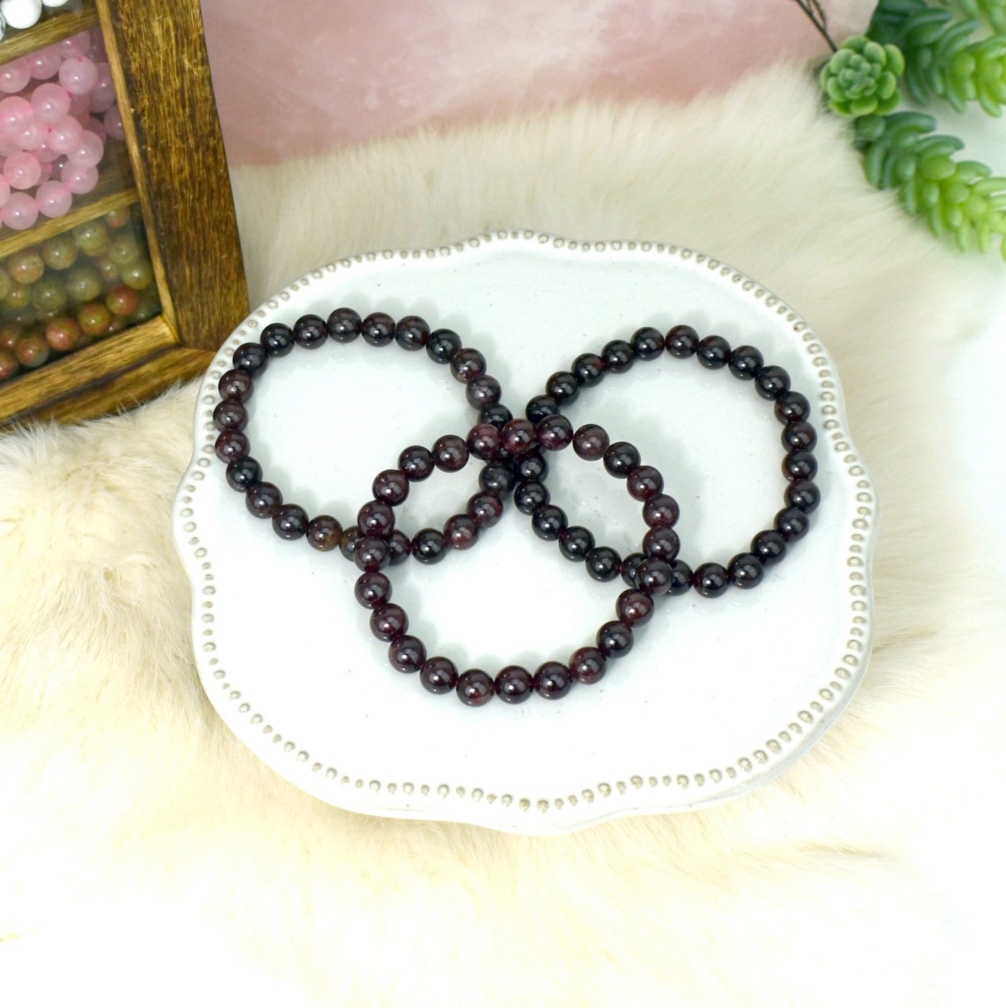 garnet bracelets with decorations in the background
