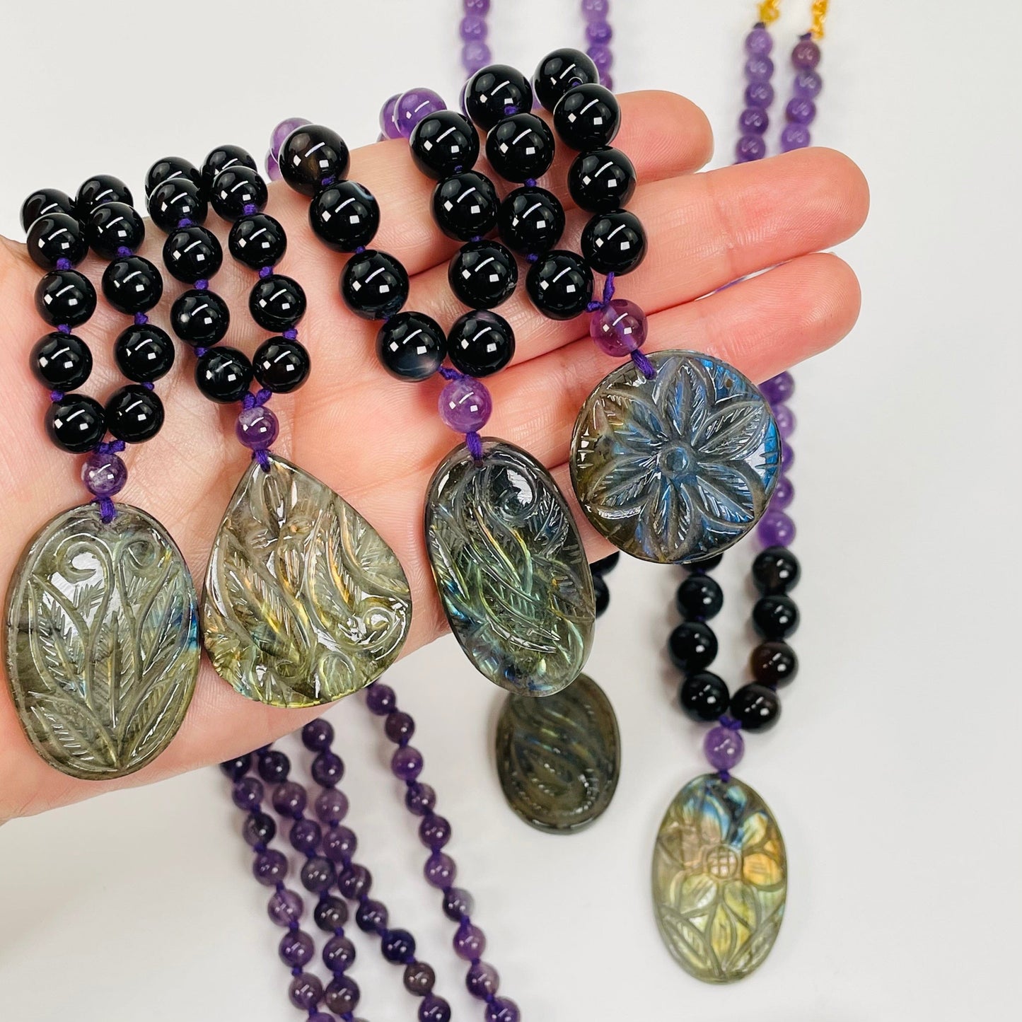 floral engraved designs on the pendants are each different