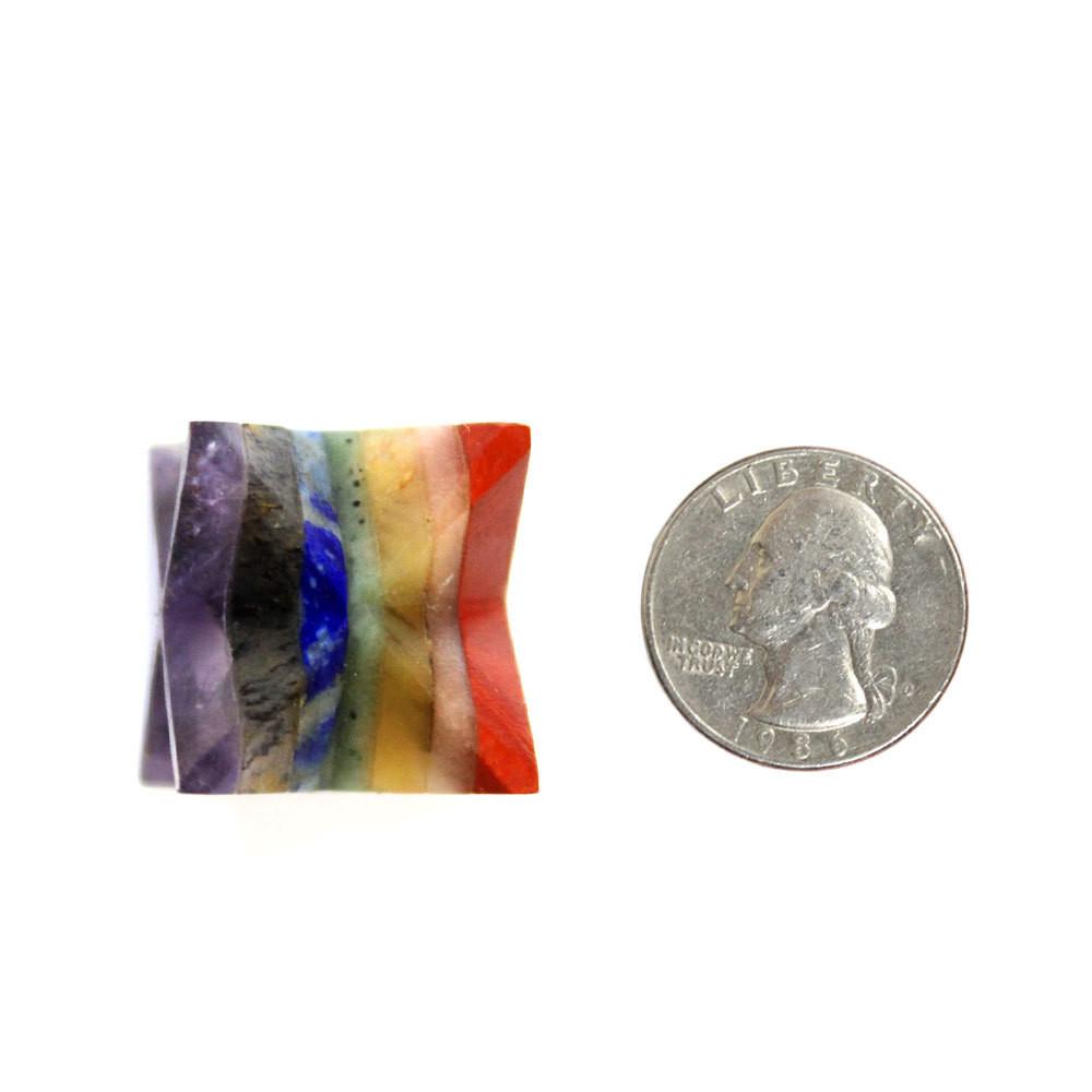 One seven chakra merkaba star compared to a quarter on a white background. The star is just slightly bigger than the quarter.