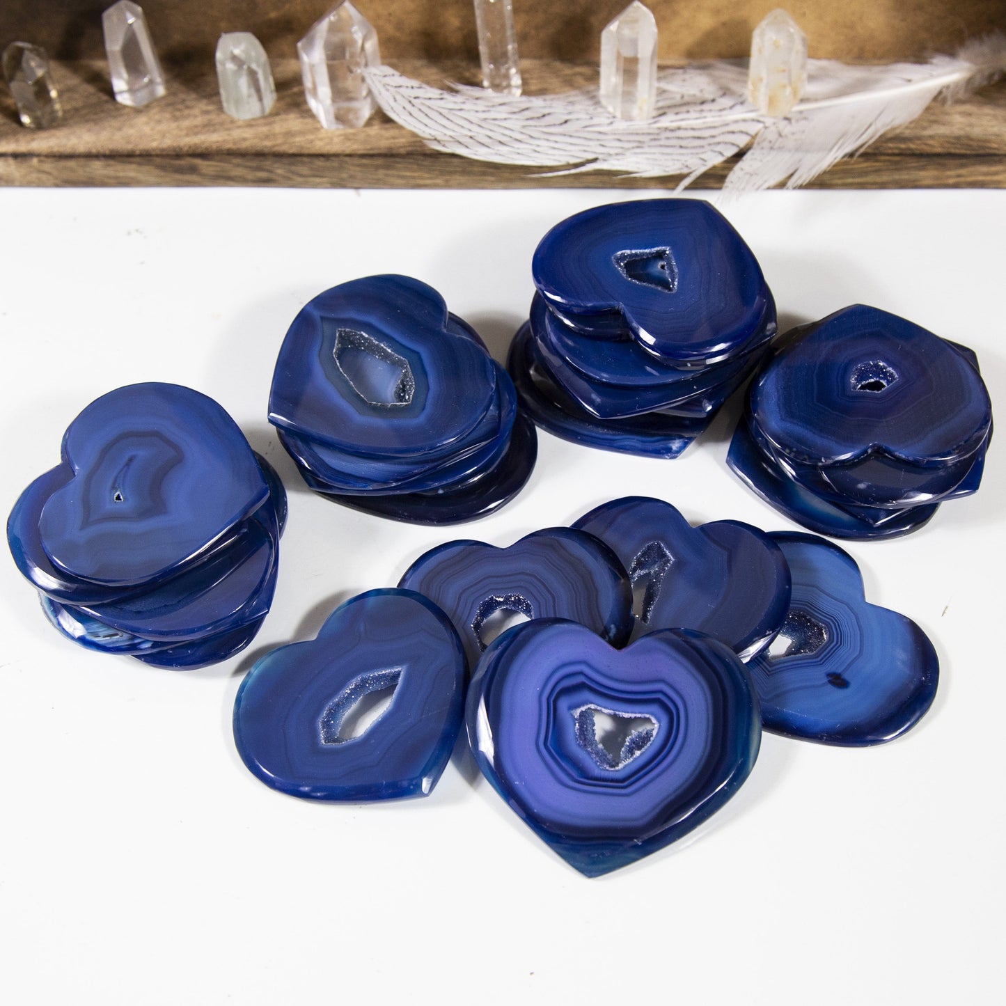 agate heart slices displayed in stacks to show thickness and color hues