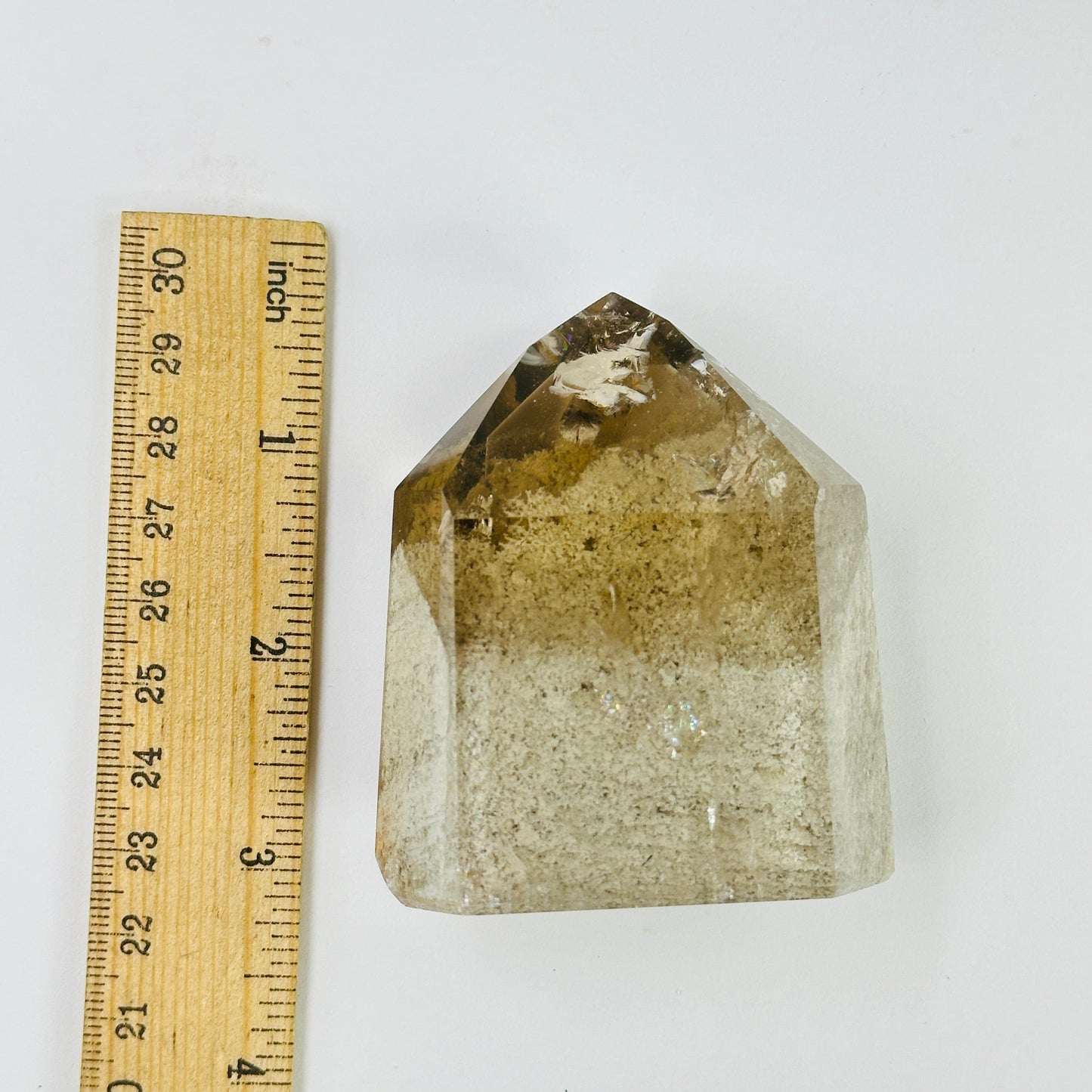 lodalite point next to a ruler for size reference