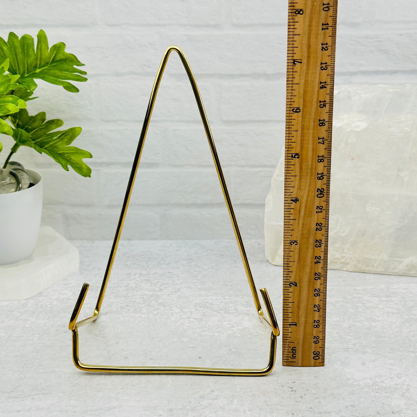 Crystal Slice Holder- Slab Stand of Brass next to a ruler for size reference