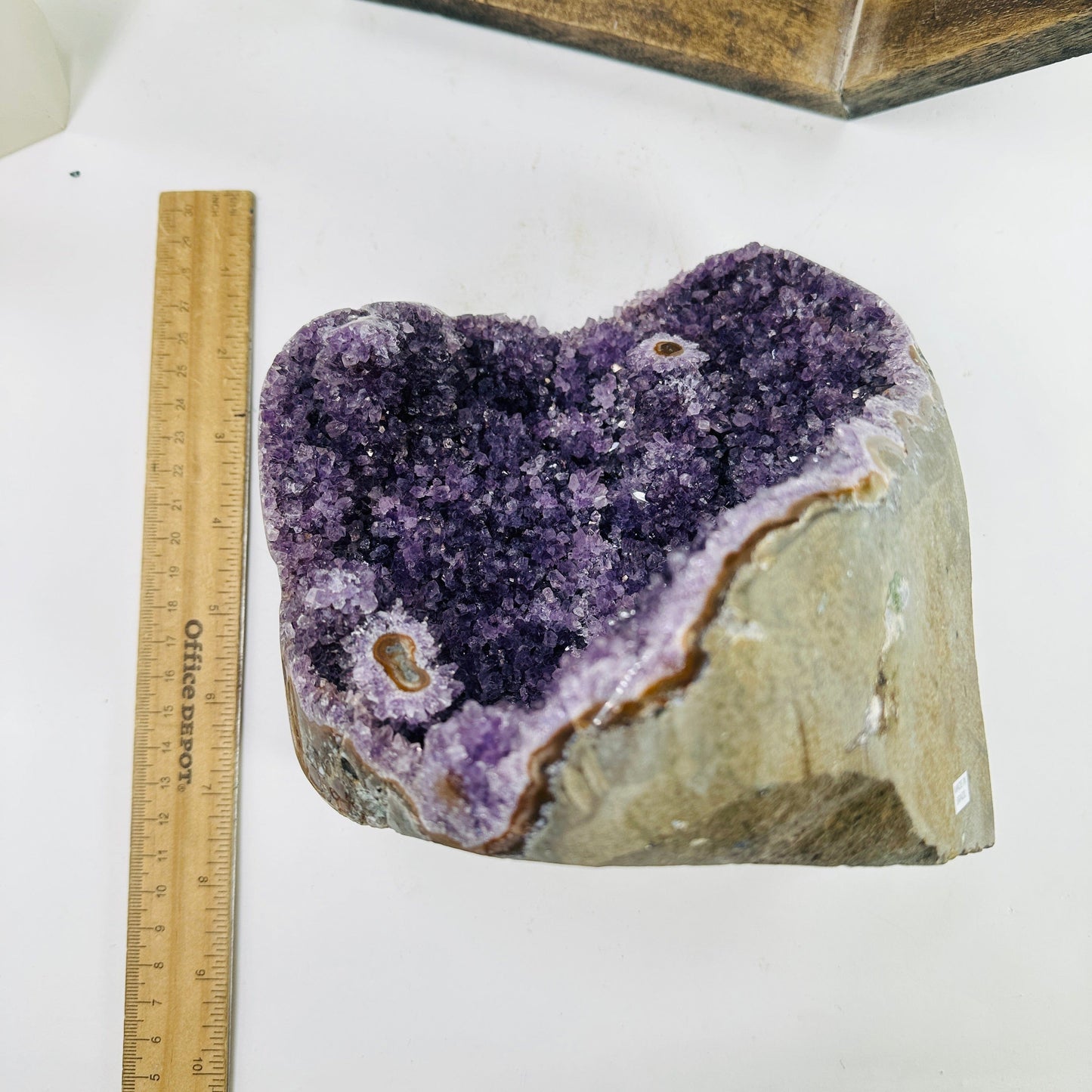amethyst cut base next to a ruler for size reference