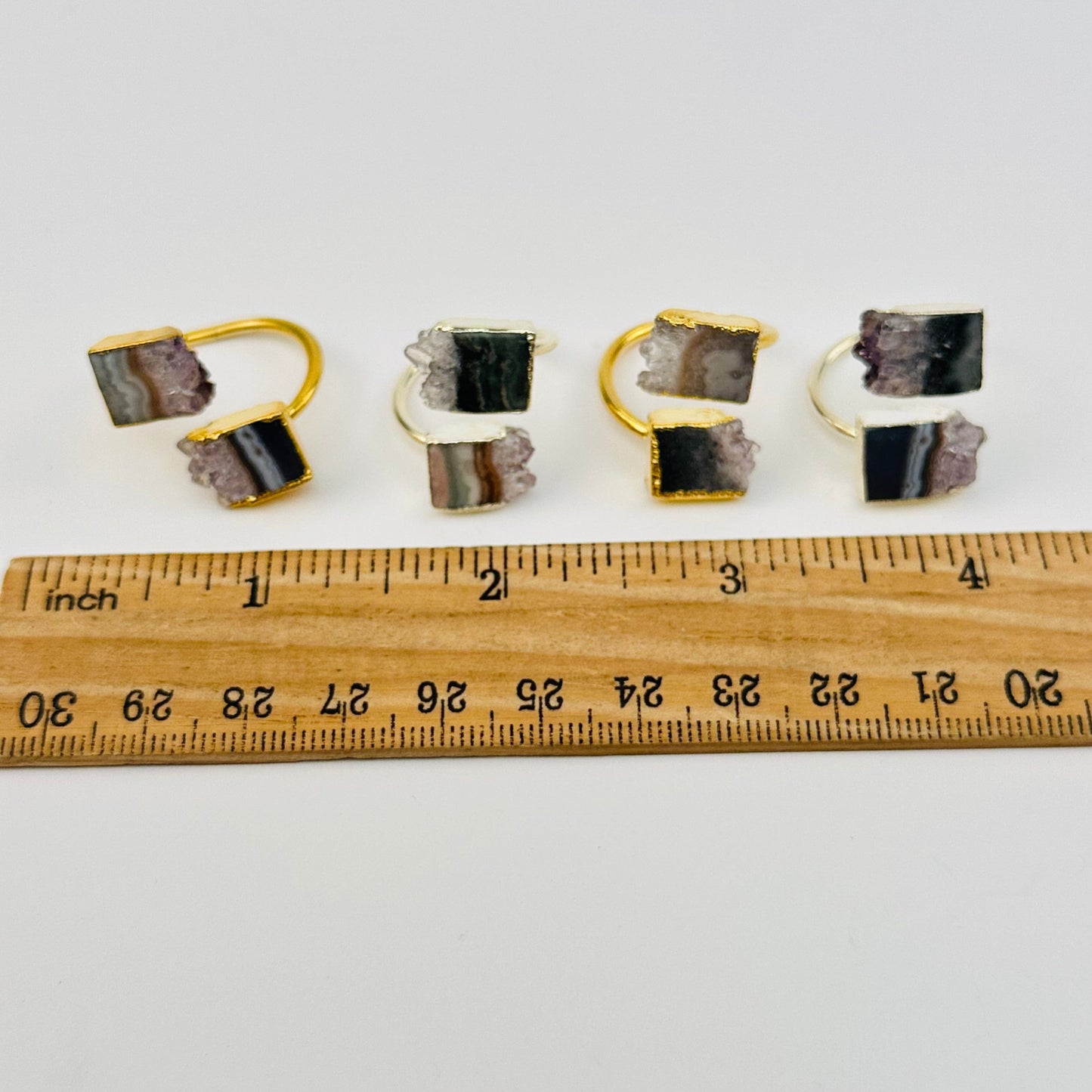rings next to a ruler for size reference