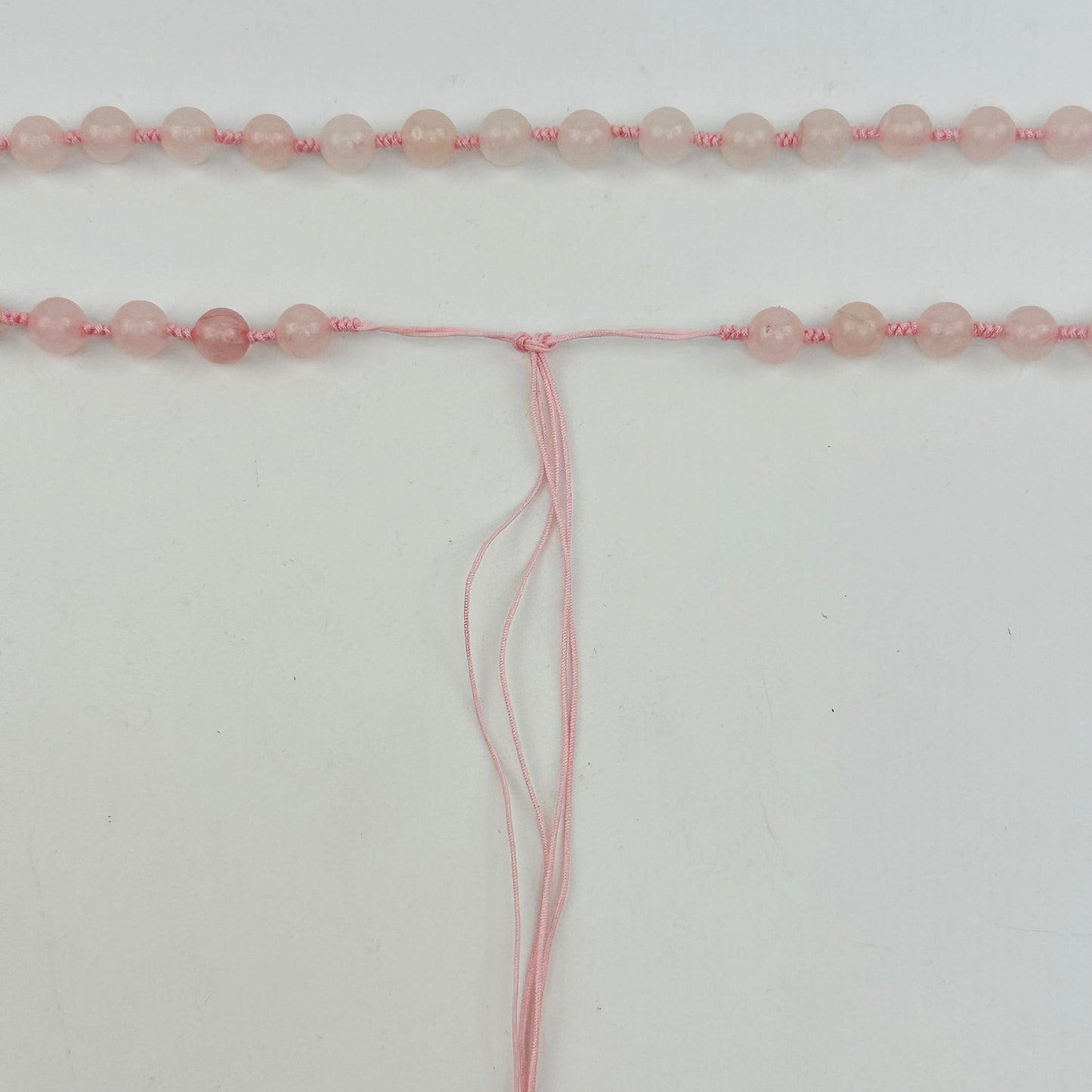 close up of the tie end of the mala necklace