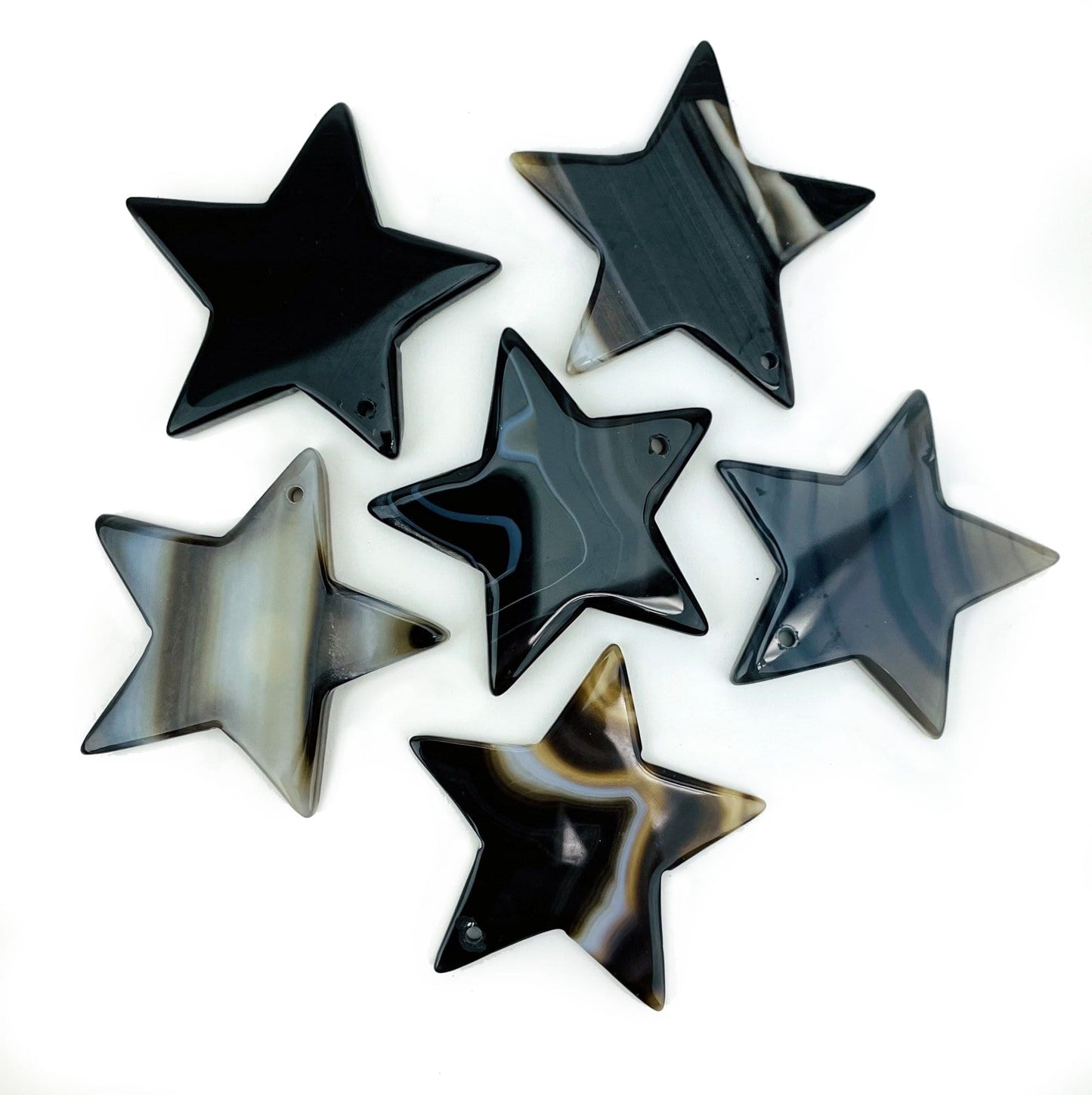 6 Black Drilled Agate Star on White Background.