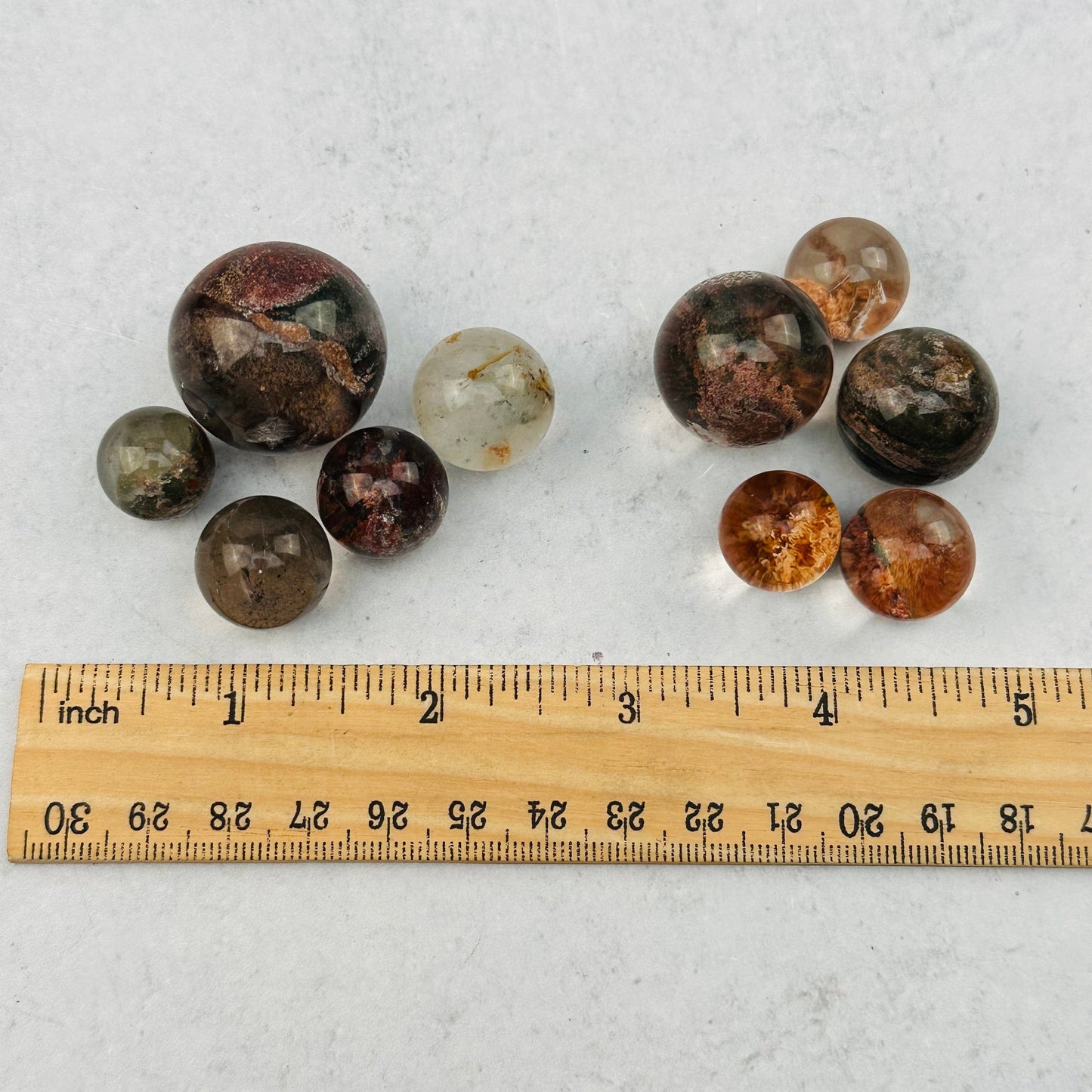 spheres next to a ruler for size reference