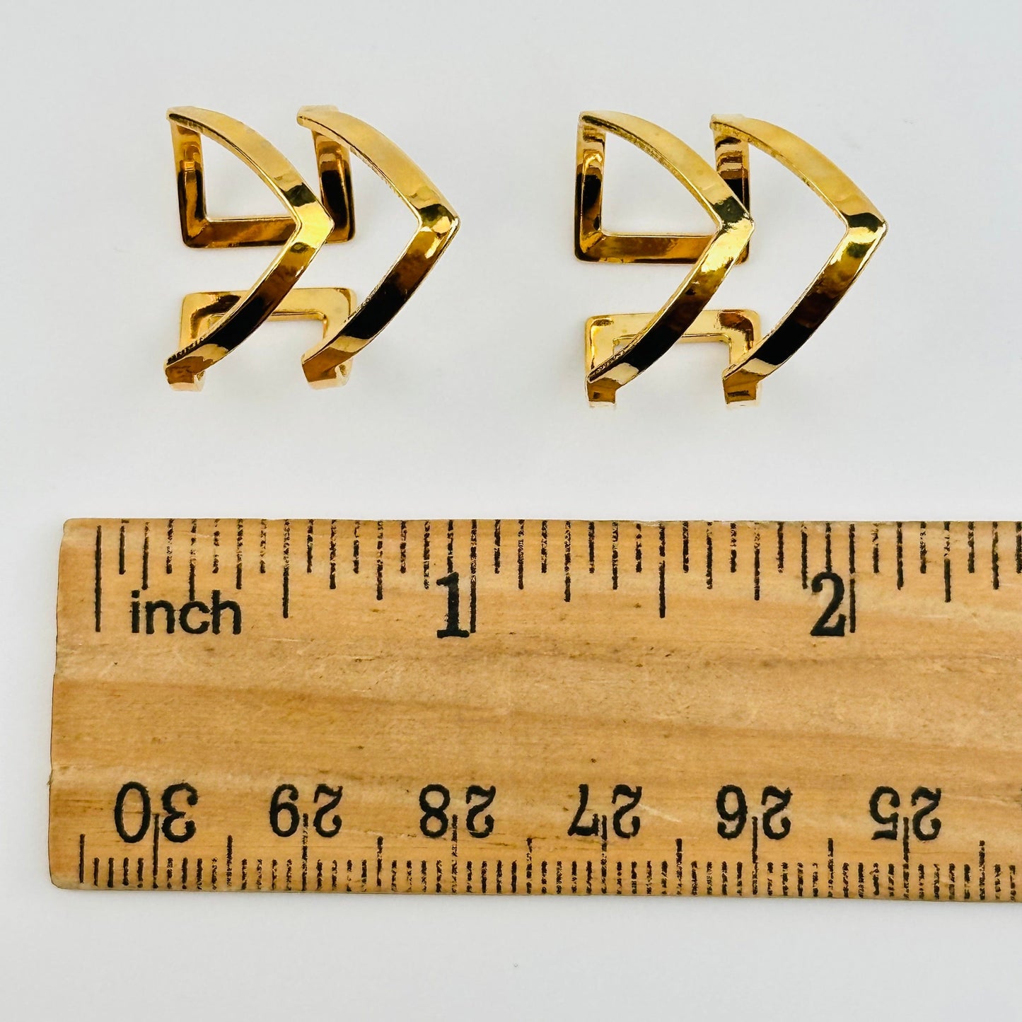 rings displayed next to a ruler for size reference