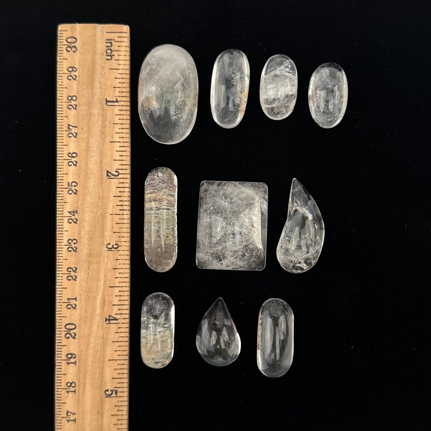 lodolite cabochons displayed next to a ruler for size reference