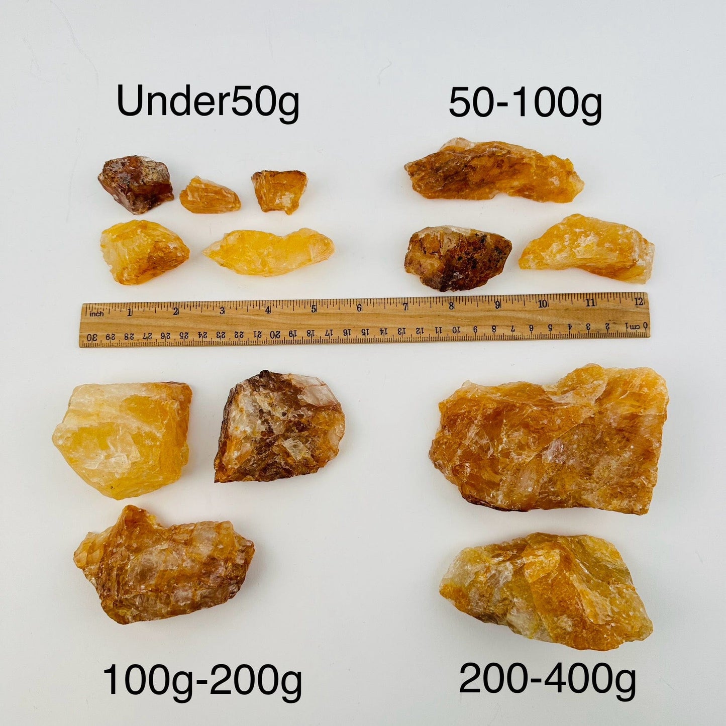 golden healer crystals sold by weight. displayed next to a ruler for size reference