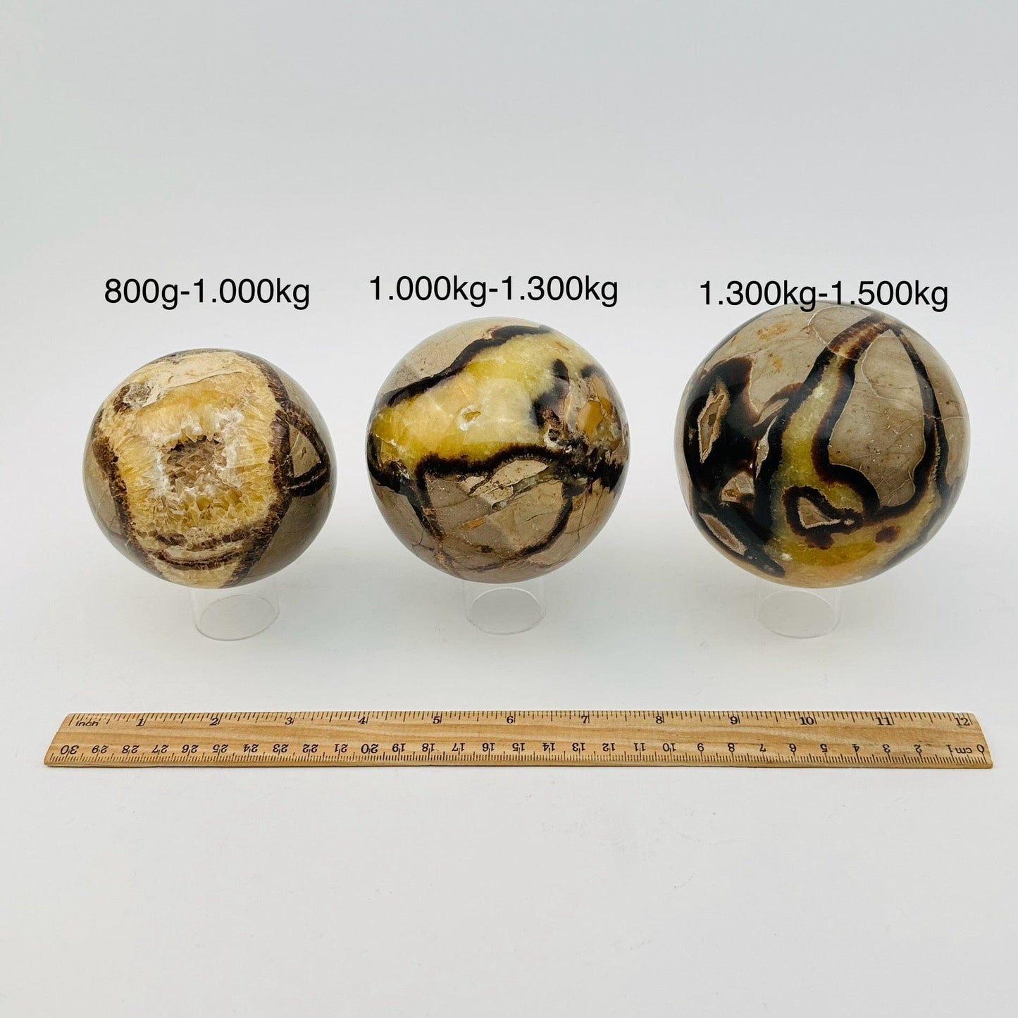 septarian spheres sold by weight. next to a ruler for size reference