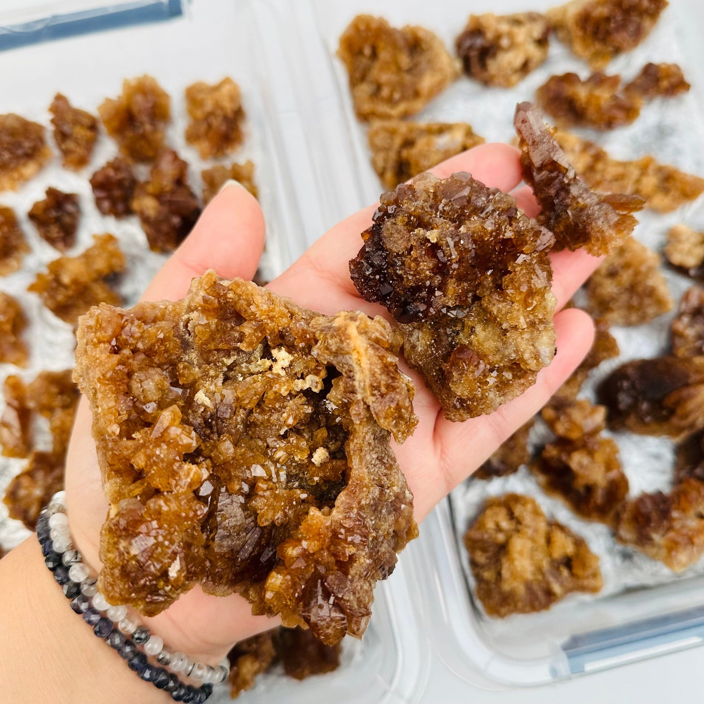 crystals in hand for size reference