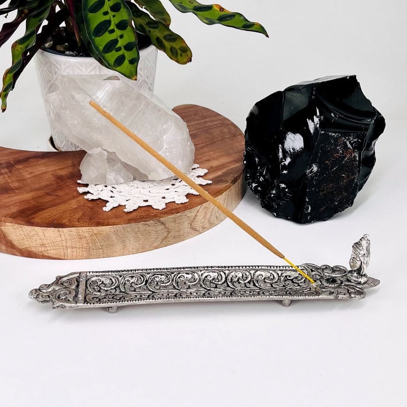 buddha head incense holder set up as home decor