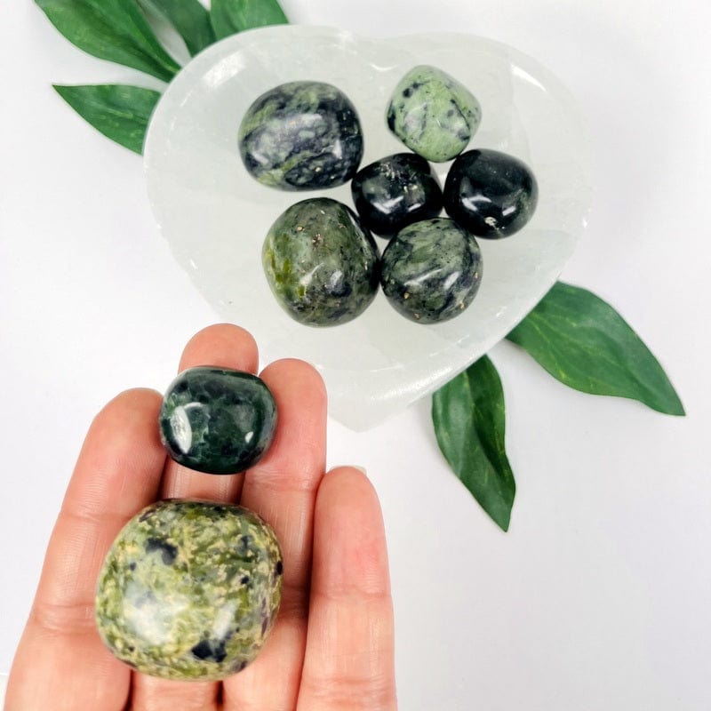 1/2 LB of nephrite tumbled stones displaying the differences in sizes
