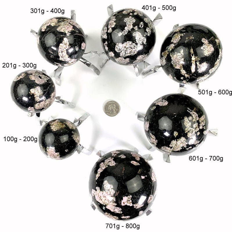 all 7 variations next to each other with a quarter in the middle