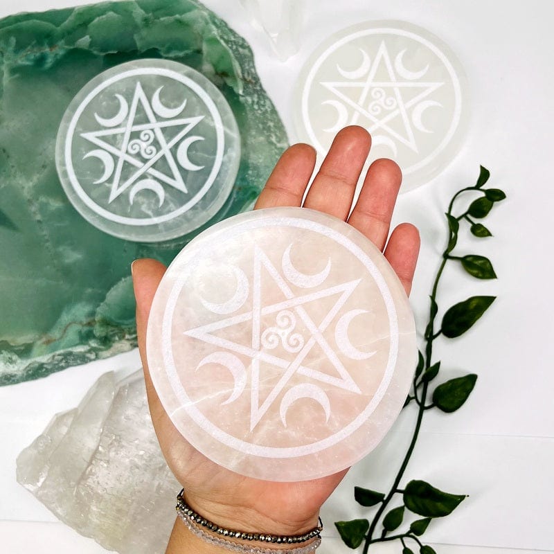 multiple selenite round plates displayed to show the slight differences