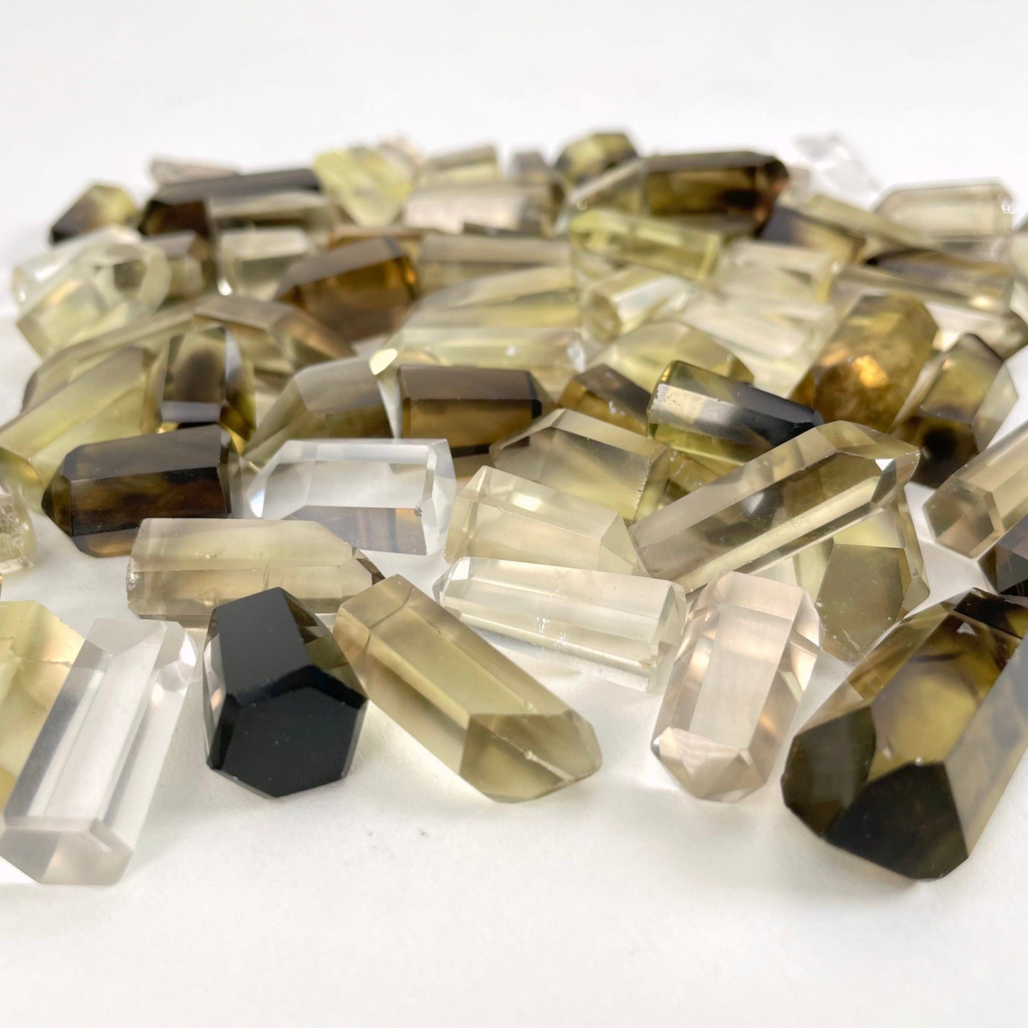 Natural Citrine Points on a white background.