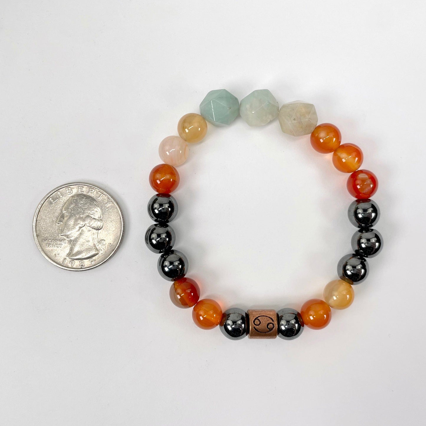 cancer zodiac bracelet with quarter for size reference