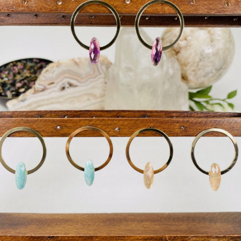 earrings displayed to show the differences in the gemstone types