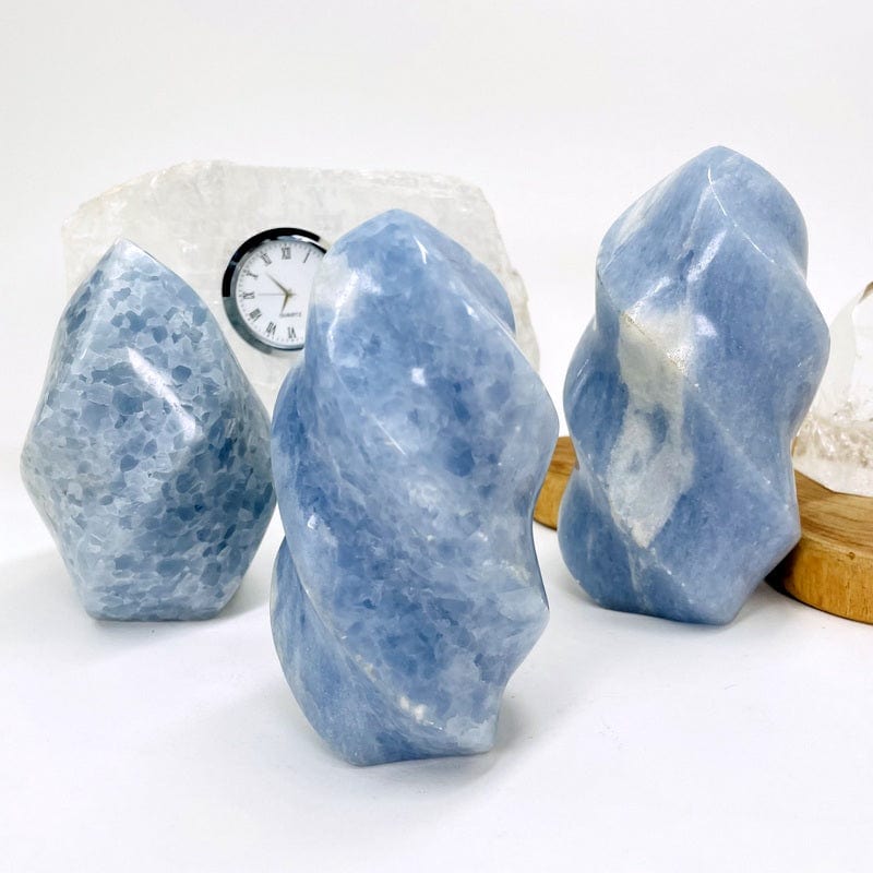 multiple blue calcite flame towers set as home decor