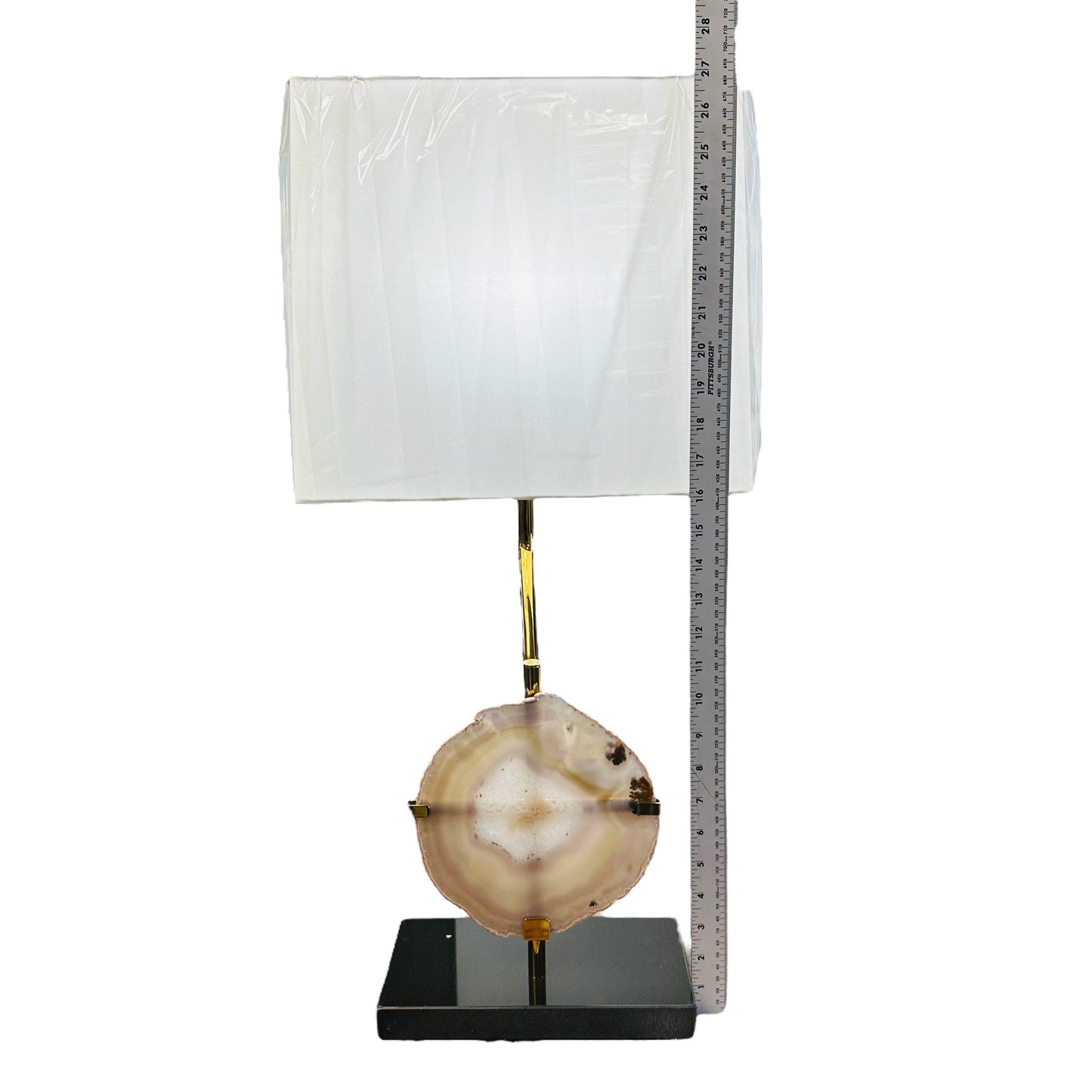 lamp next to a ruler for size reference
