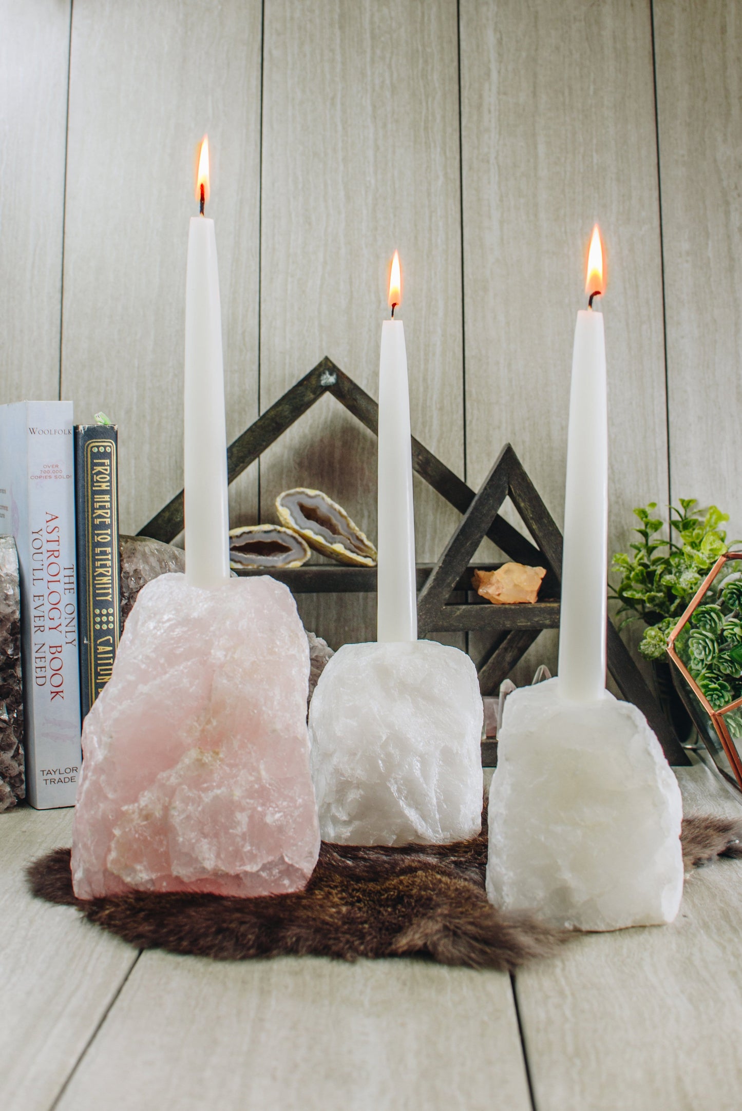 3 candle holders on a table
