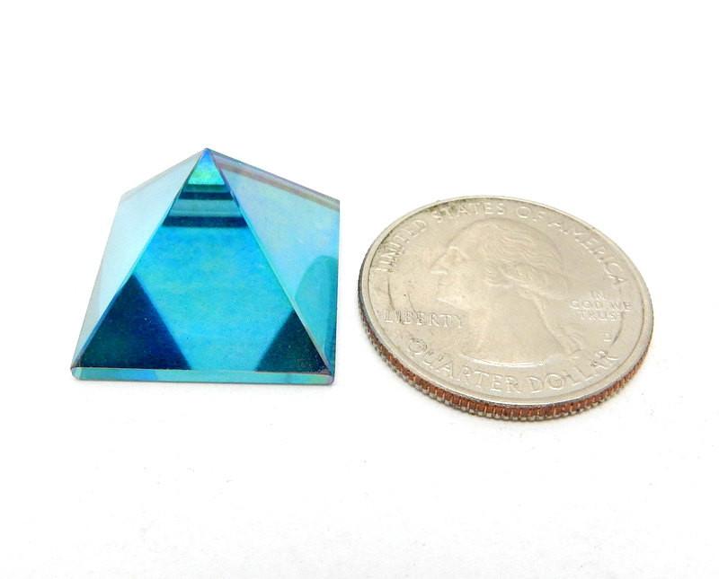pyramid next to a quarter for size reference