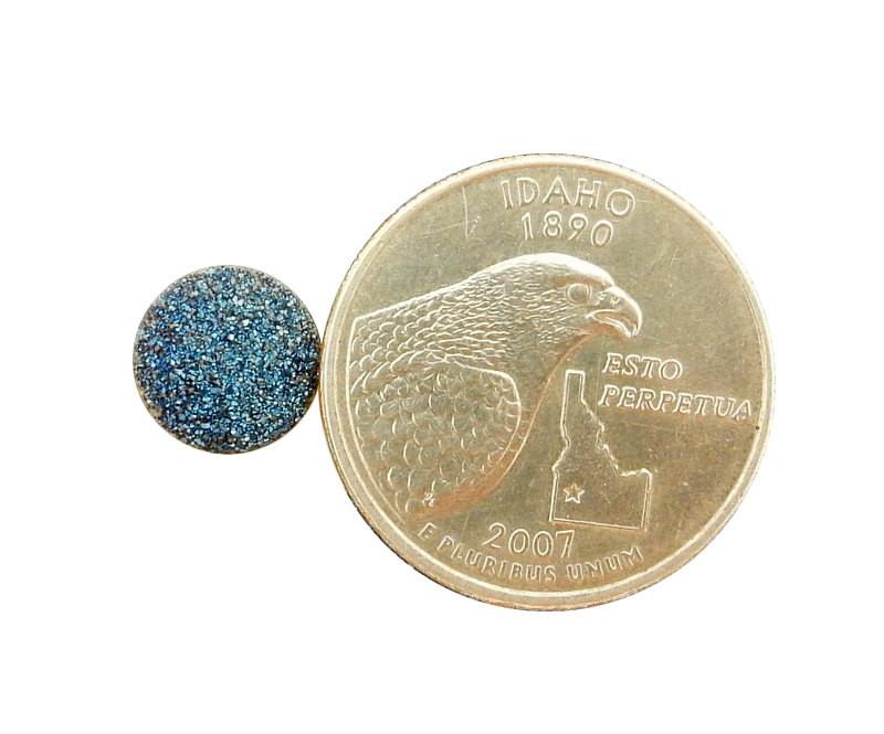 Blue Round Shaped Druzy Cabochon next to a quarter for size reference