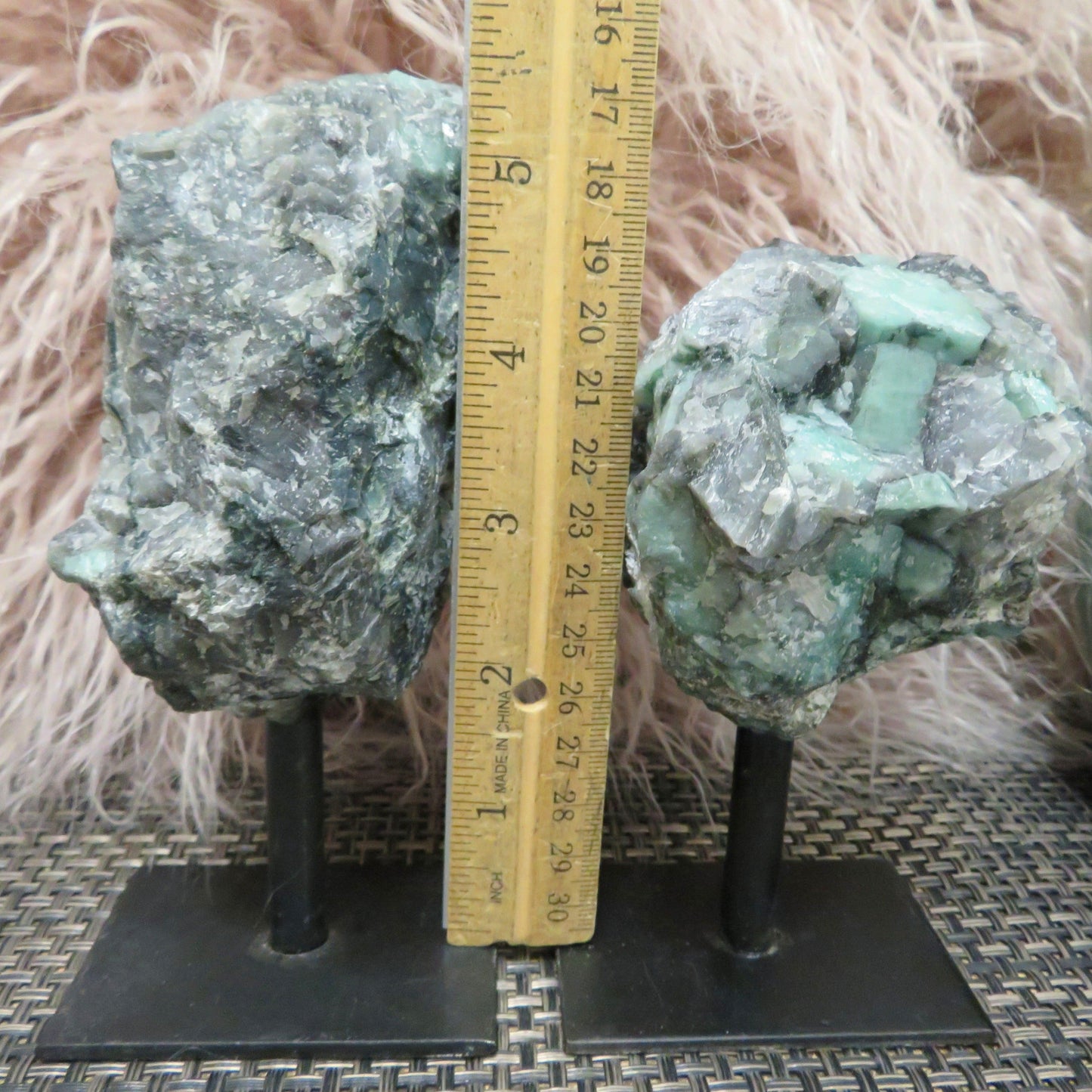 2 Emerald on Metal Stand with a ruler in the middle of each other showing the different measurements