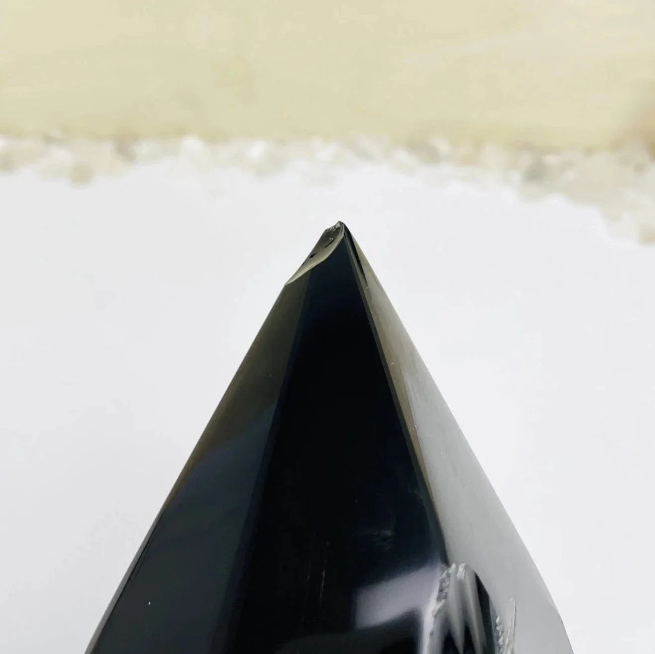 obsidian with decorations in the background