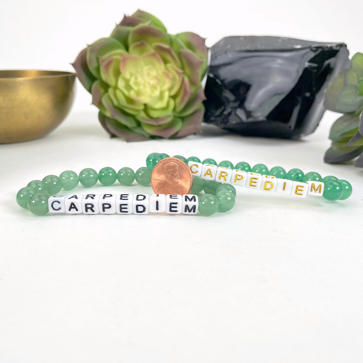 green aventurine Crystal Mala Bead Bracelet - CARPE DIEM next to a coin for size reference