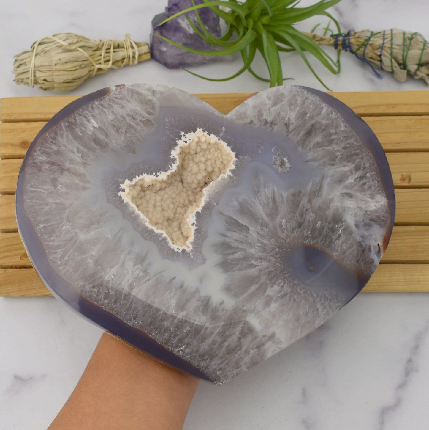 Front facing Agate Druzy Heart - OOAK - (DOOAK-S24-06) in a hand within an alter.