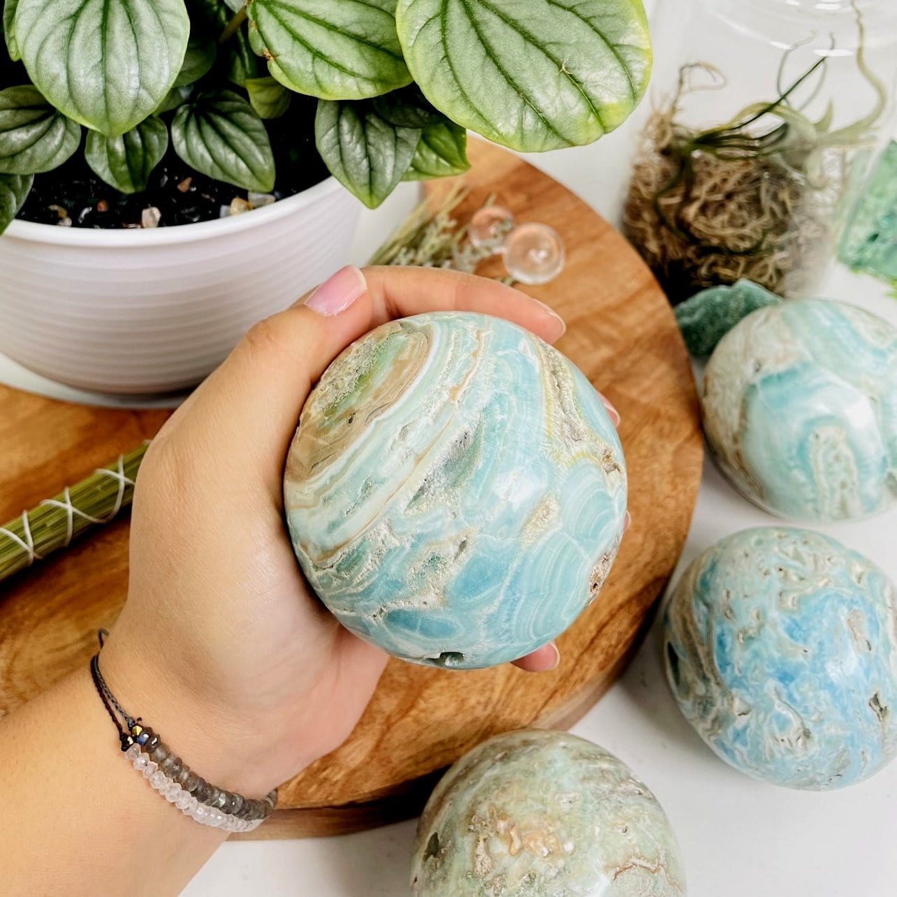 Blue Aragonite Spheres - Also known as Caribbean Calcite in a hand