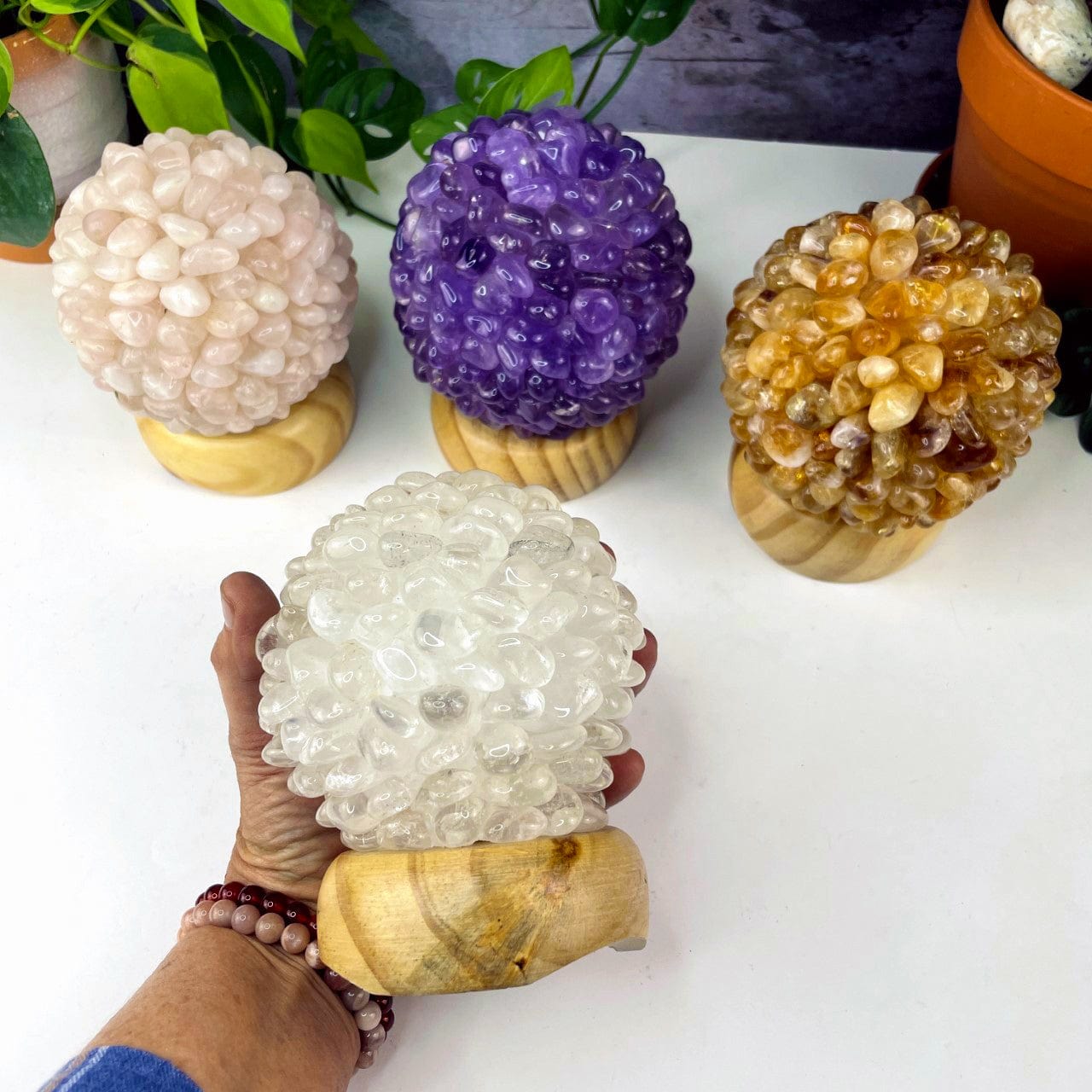Tumbled Stone lamps with light wood base, shown here with one in a hand for size reference