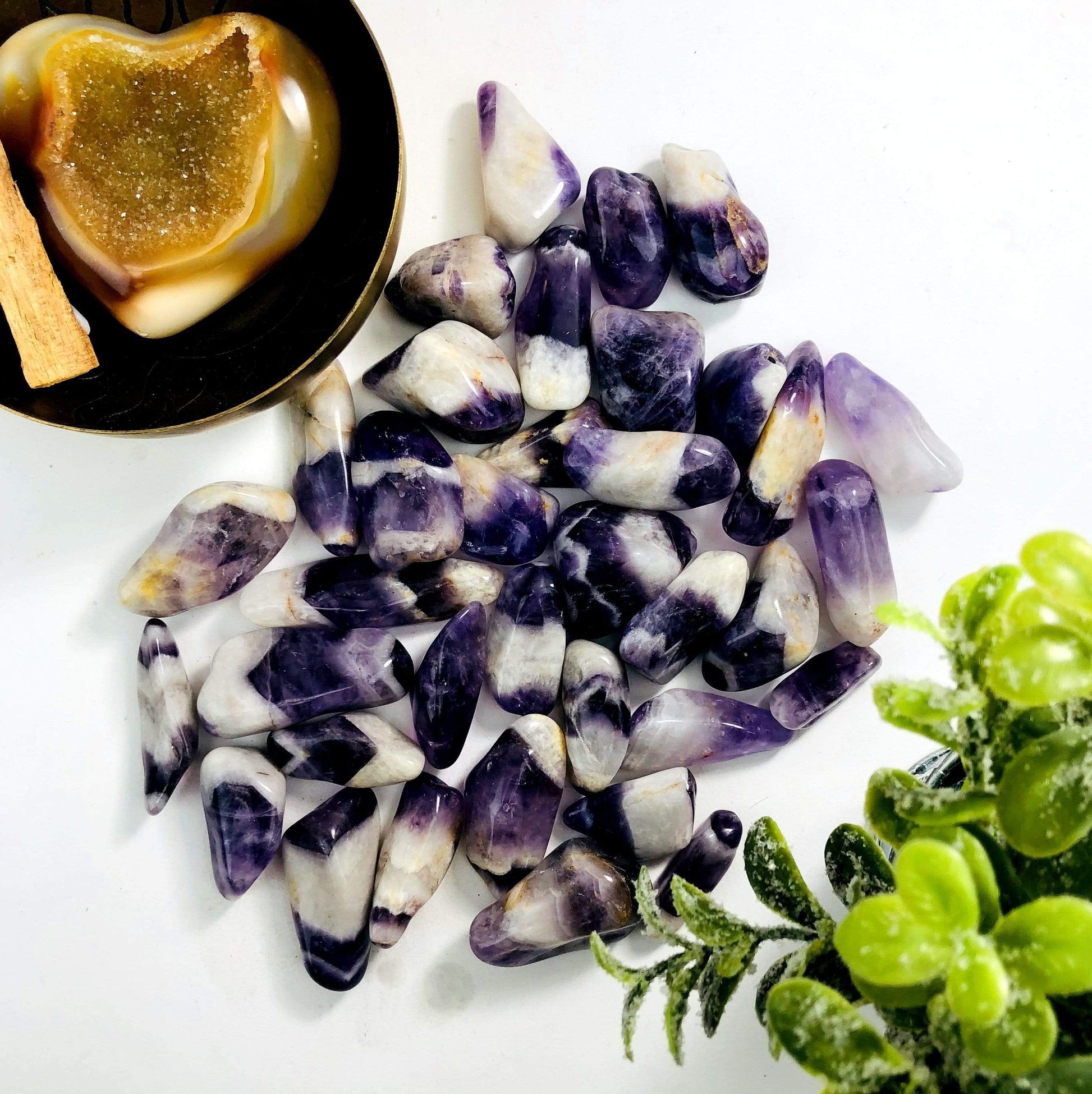 Chevron Amethyst Tumbled Gemstones on white background