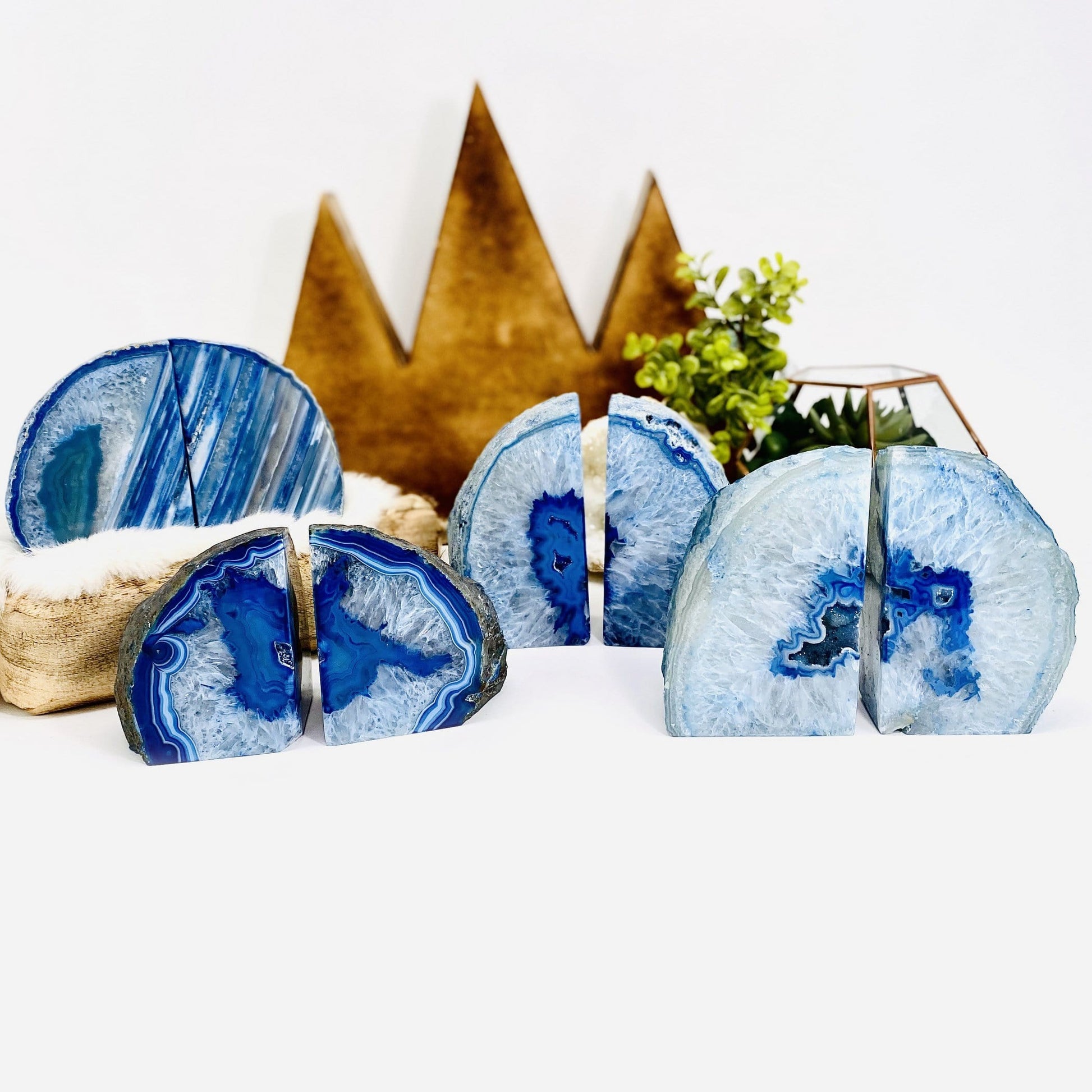4 blue agate bookends on a table