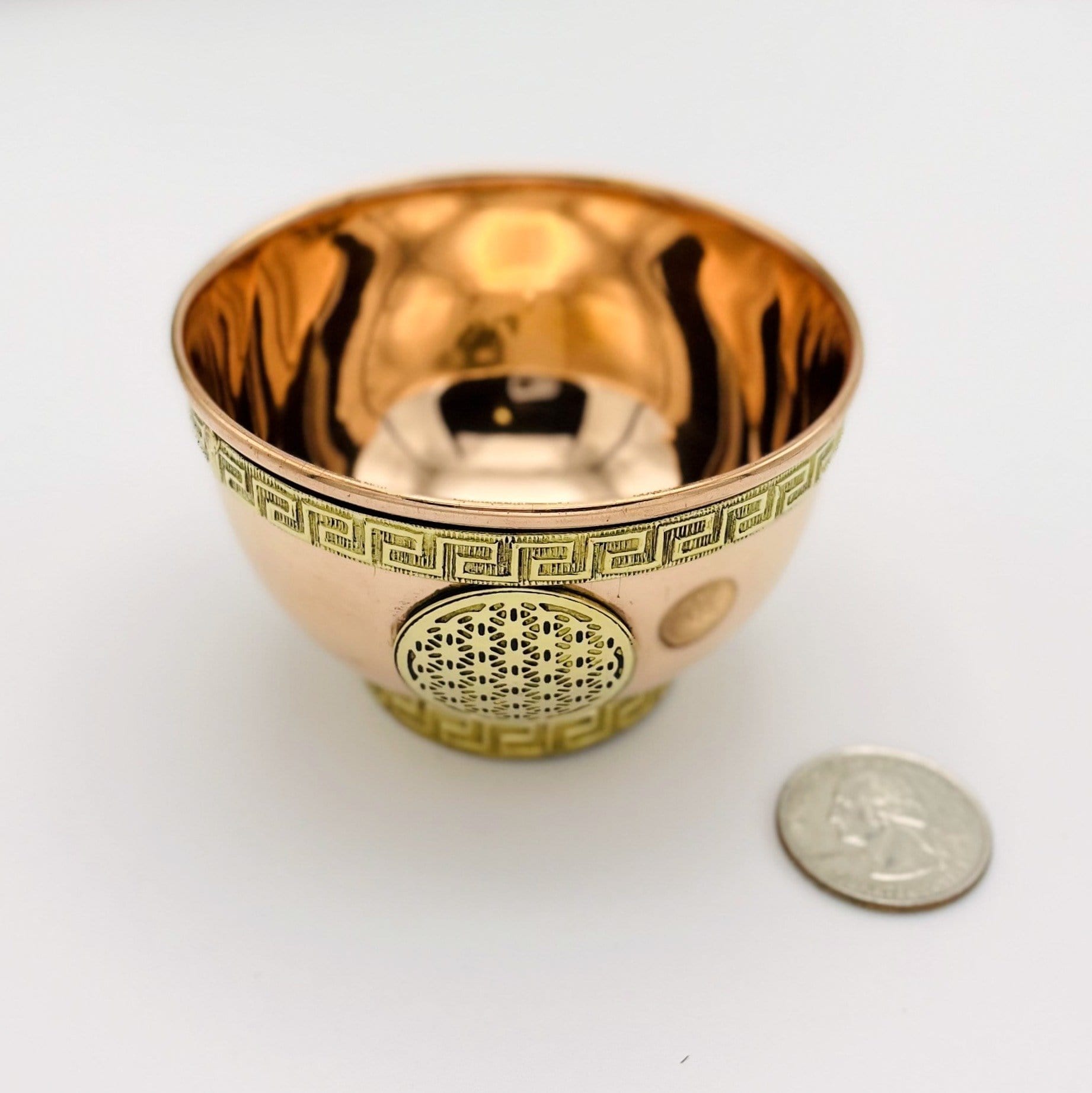 offering bowl next to a quarter
