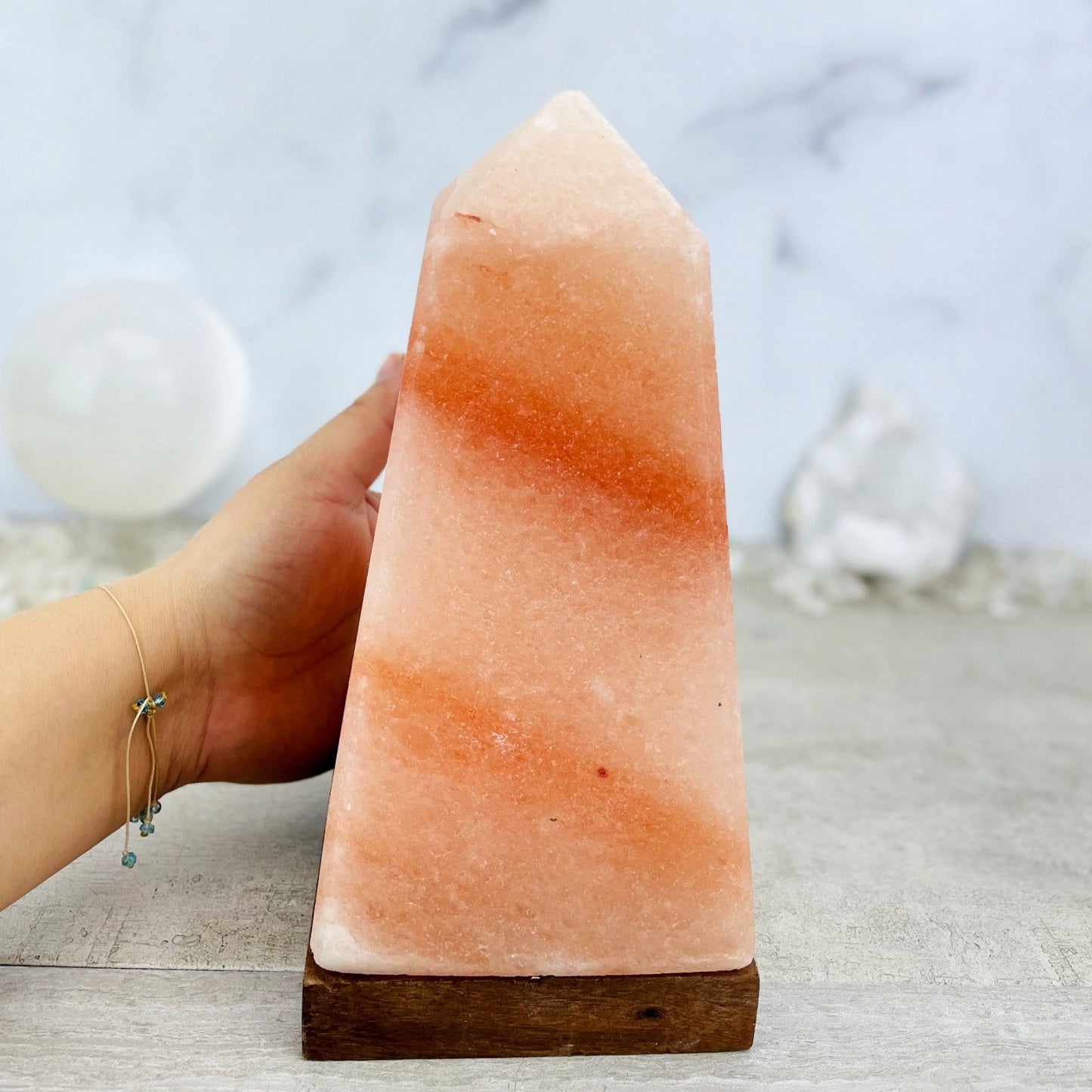 salt lamp next to hand for size reference 