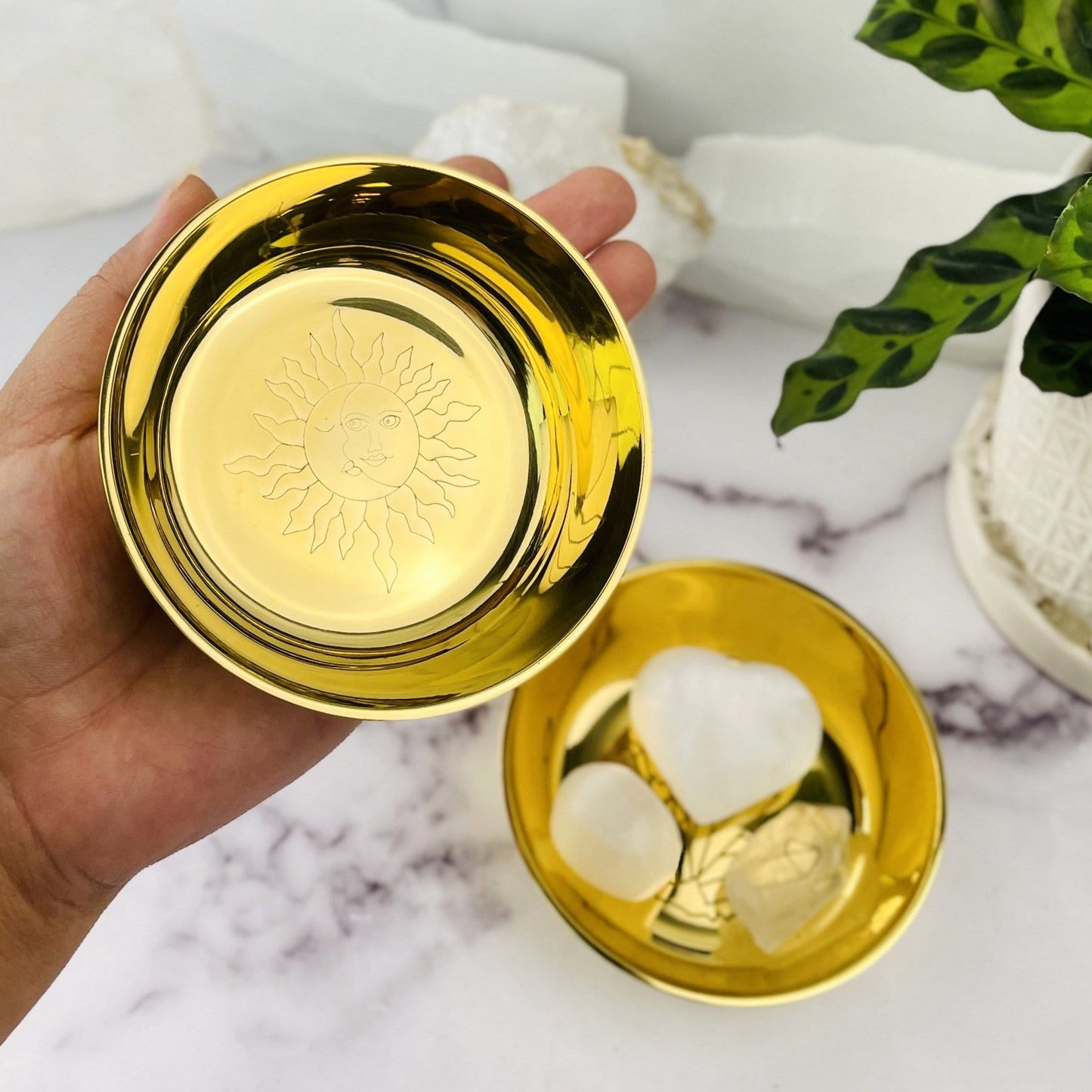Sun and Moon Brass Offering Bowl on hand for size comparison
