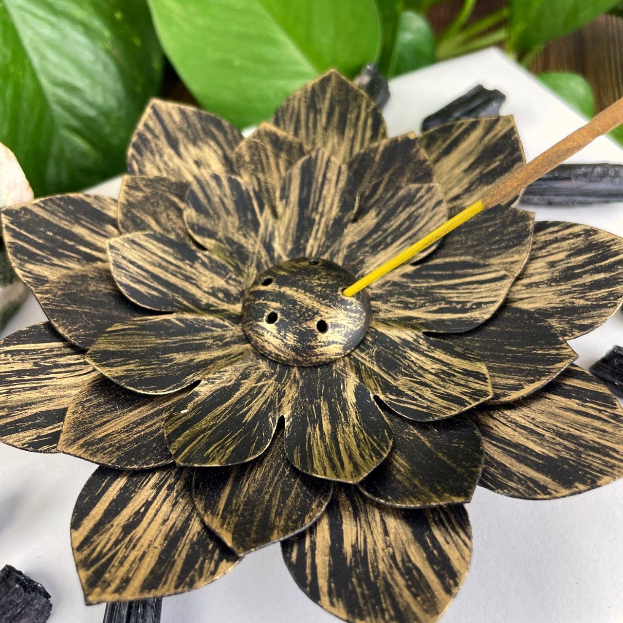Metal Lotus Incense Holder Burner in golden color with incense in place
