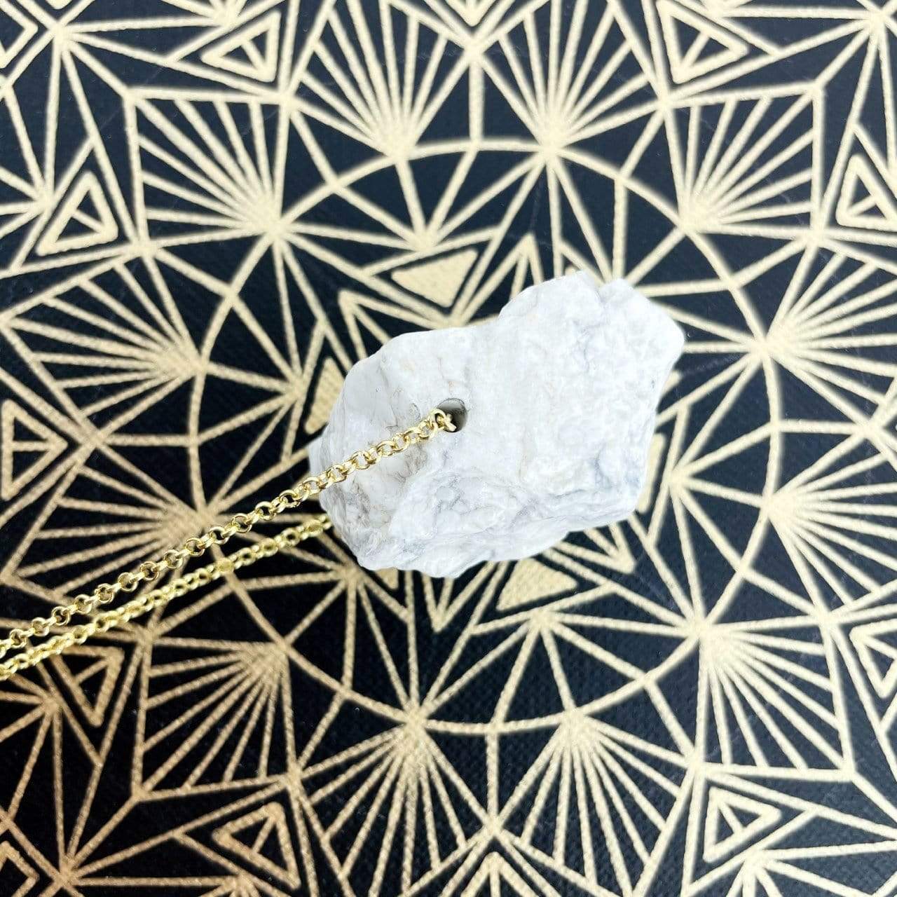 Up close shot of Healing Stone Necklace on crystal grid