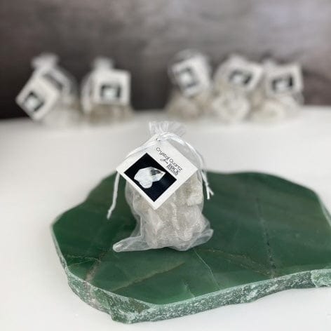 5 Crystal Clusters and Points "The Power Stones" Set in an organza bag tied and tagged with information card with other bags in the background