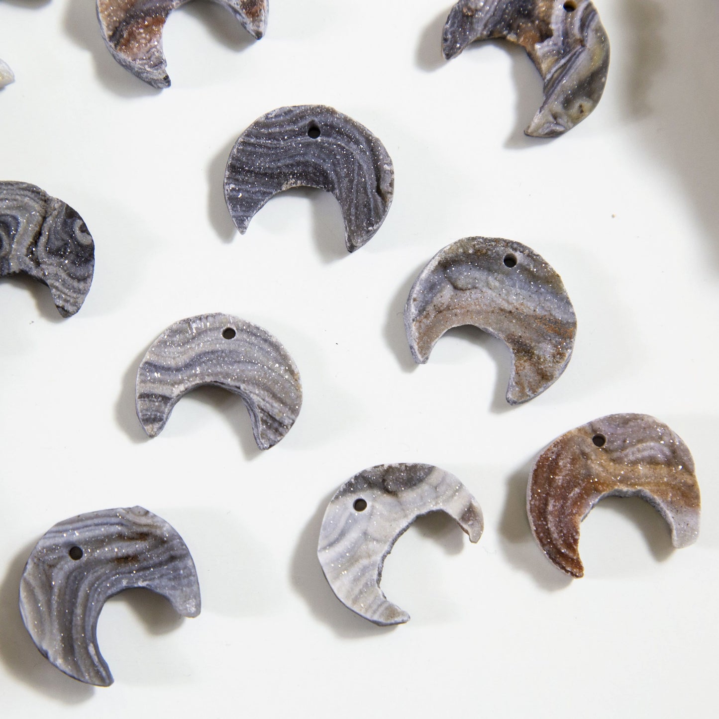 6 Raw Chalcedony Moon Crescents on white background