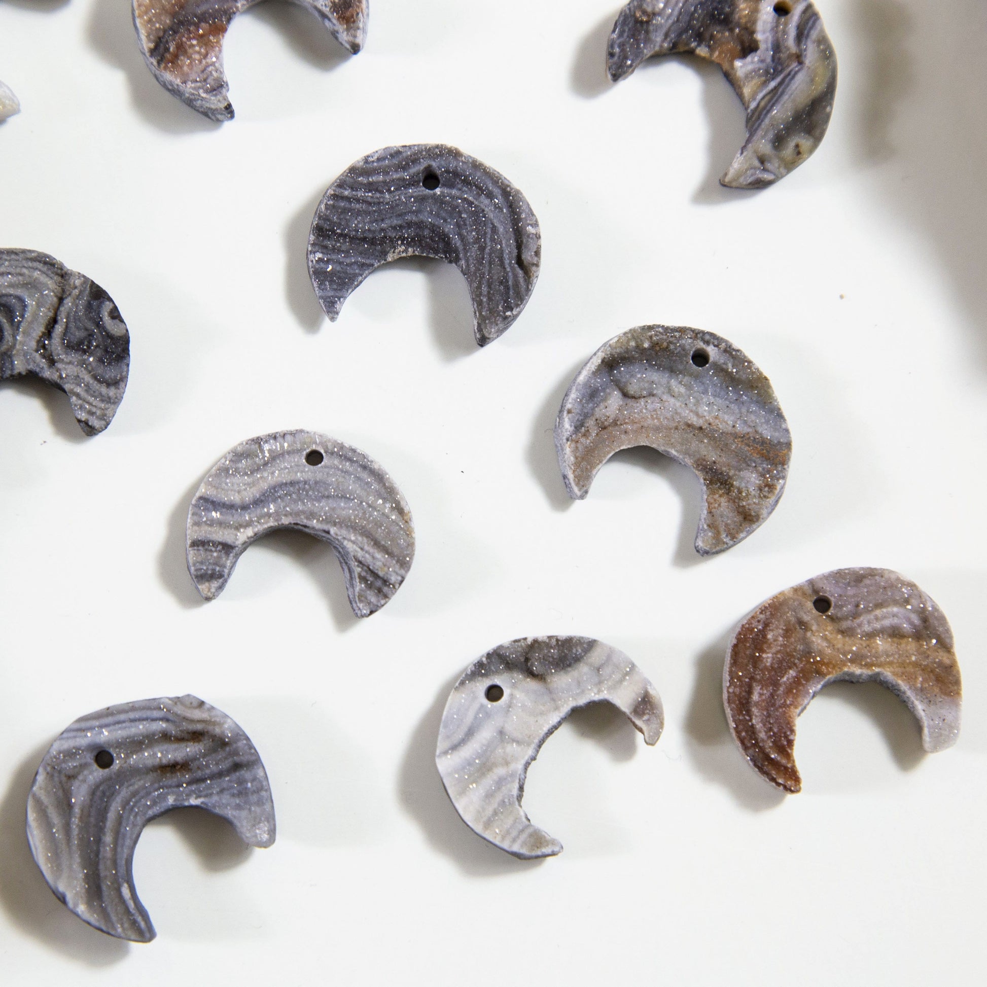6 Raw Chalcedony Moon Crescents on white background