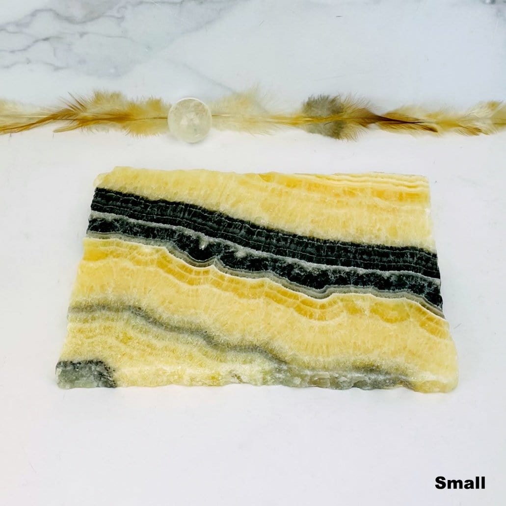 small Mexican onyx platter with decorations in the background