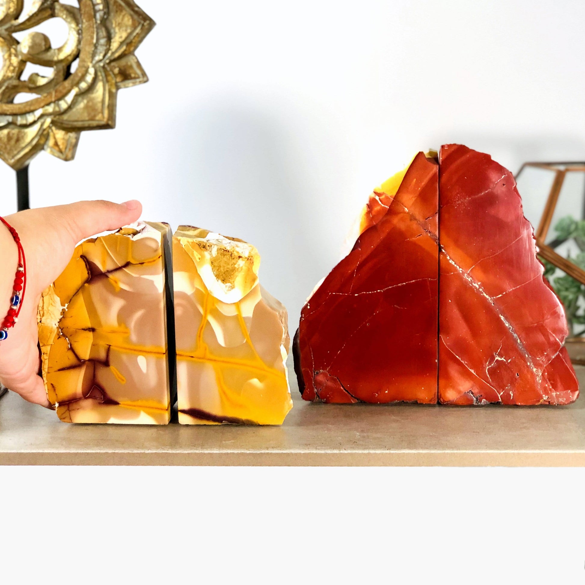 Mookaite Bookend sets displayed by hand for size reference
