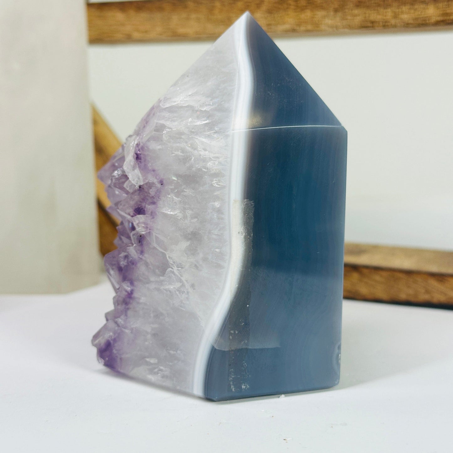 amethyst point with decorations in the background