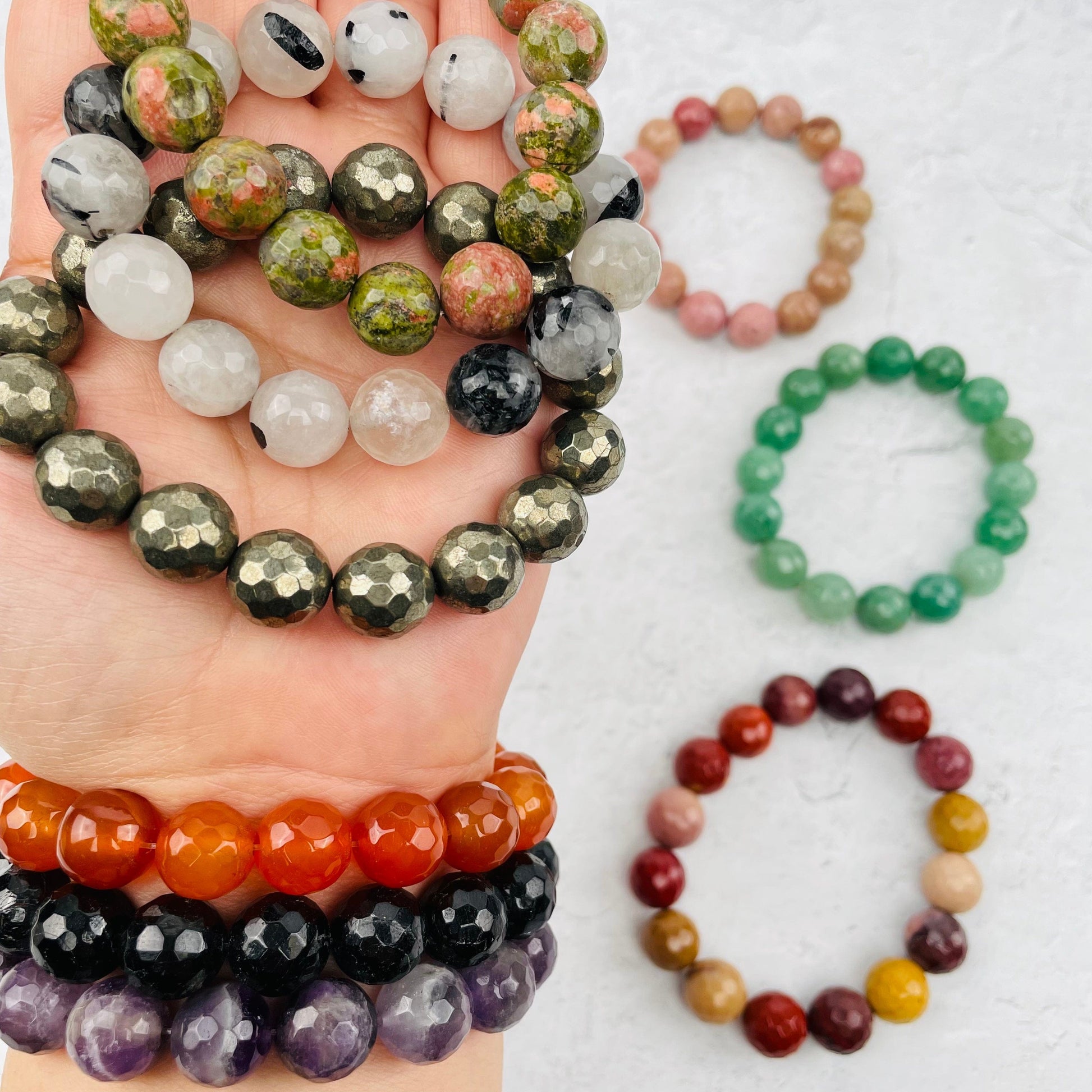faceted bracelets in hand for size reference 